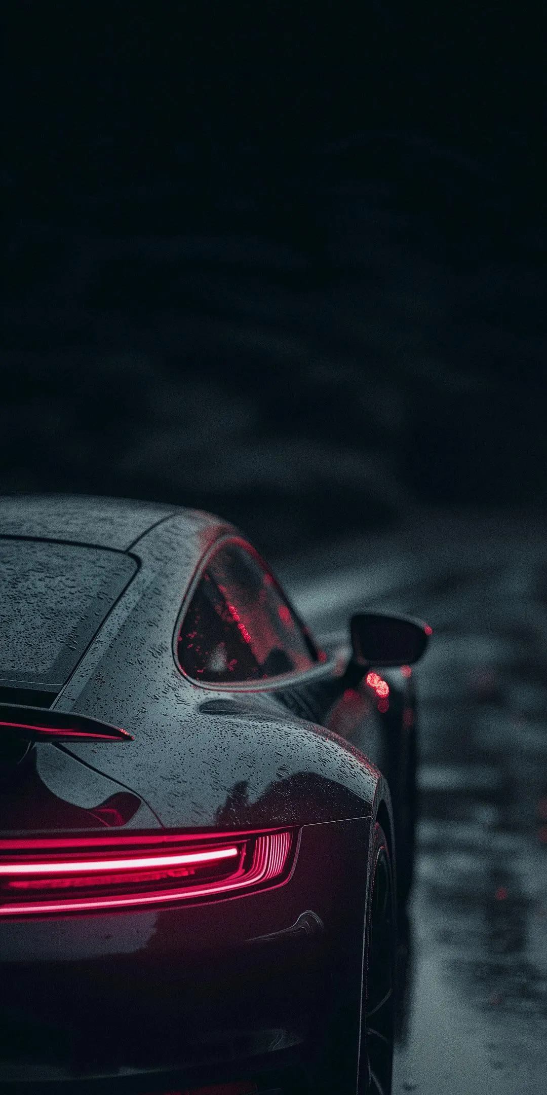 Sports Car with Red Lights in Rainy Urban Street Scene