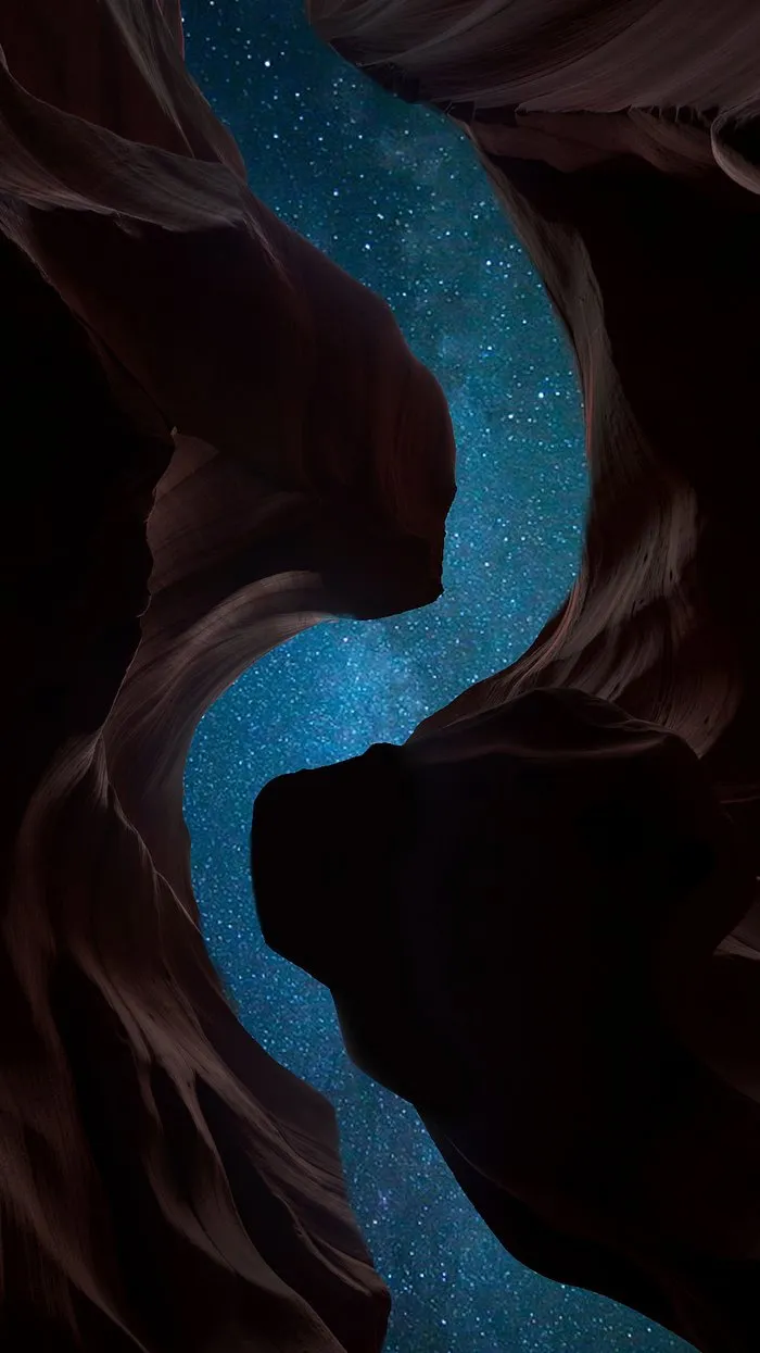 Starry Night Sky Framed by Majestic Canyon Formations