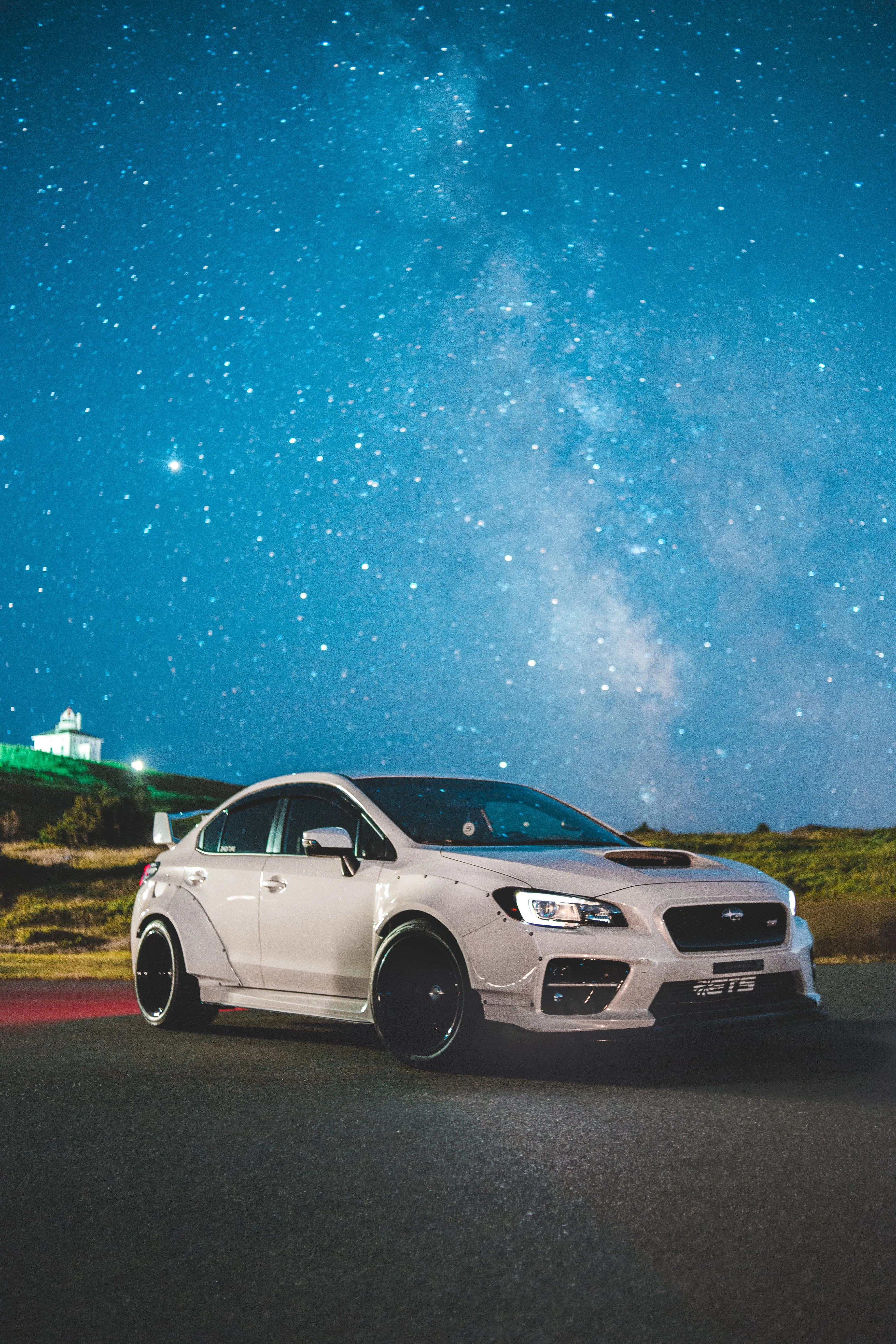 Starry Night Sky Over White Sports Car Free Wallpaper