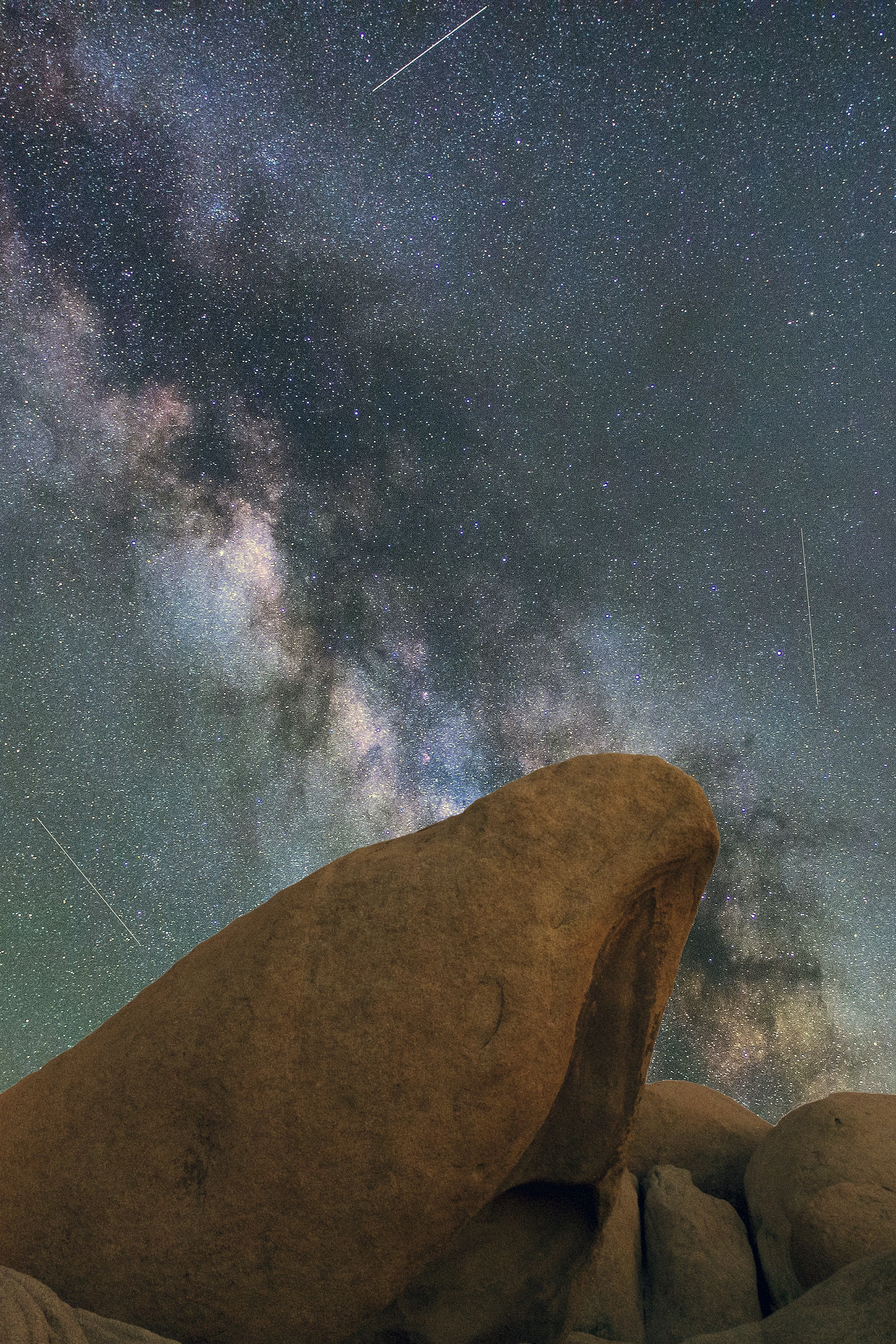 Starry Sky over Large Rock Formation at Night Wallpaper