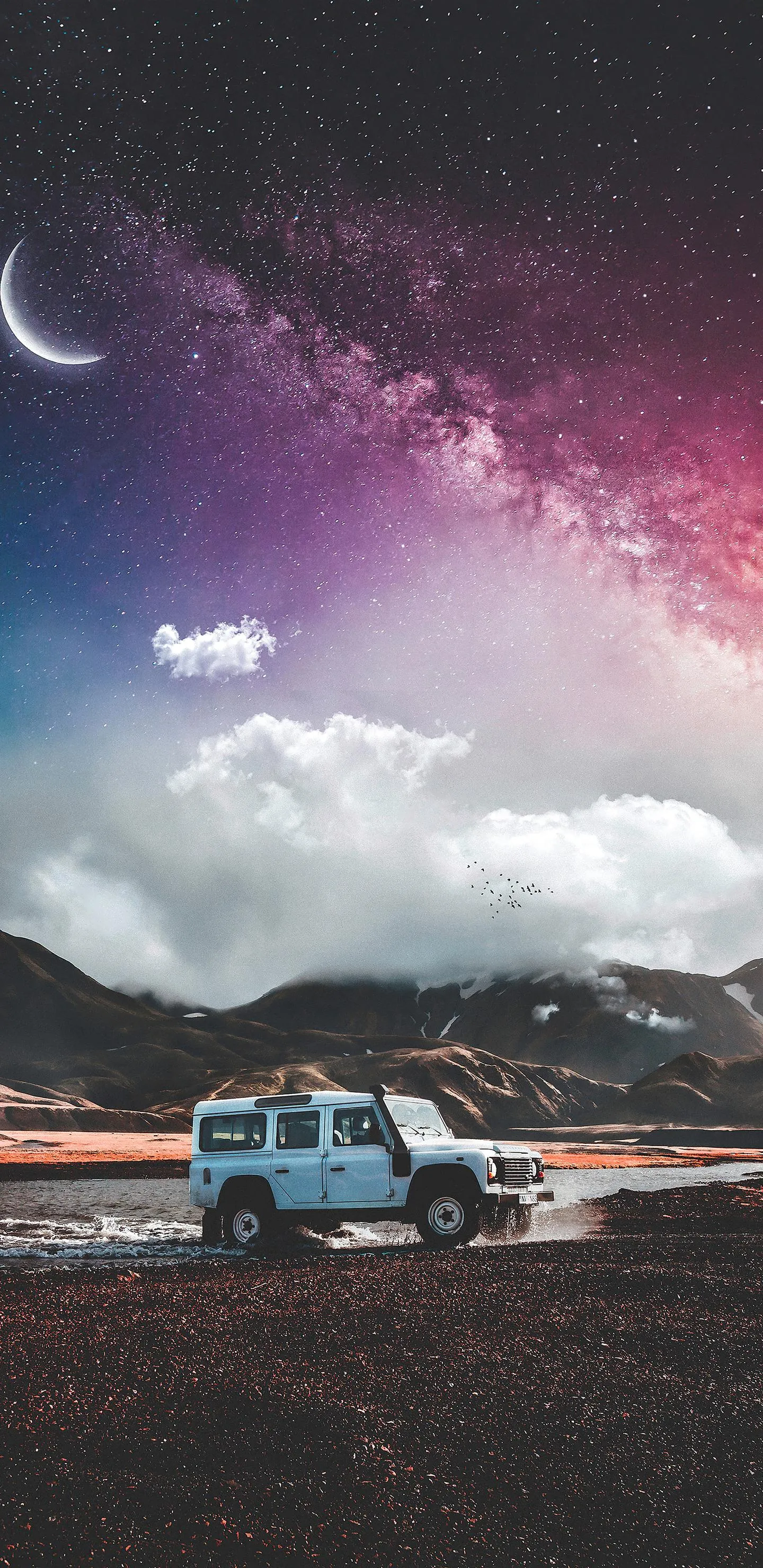 Stunning Car Under a Starry Sky in Desert Road Scene