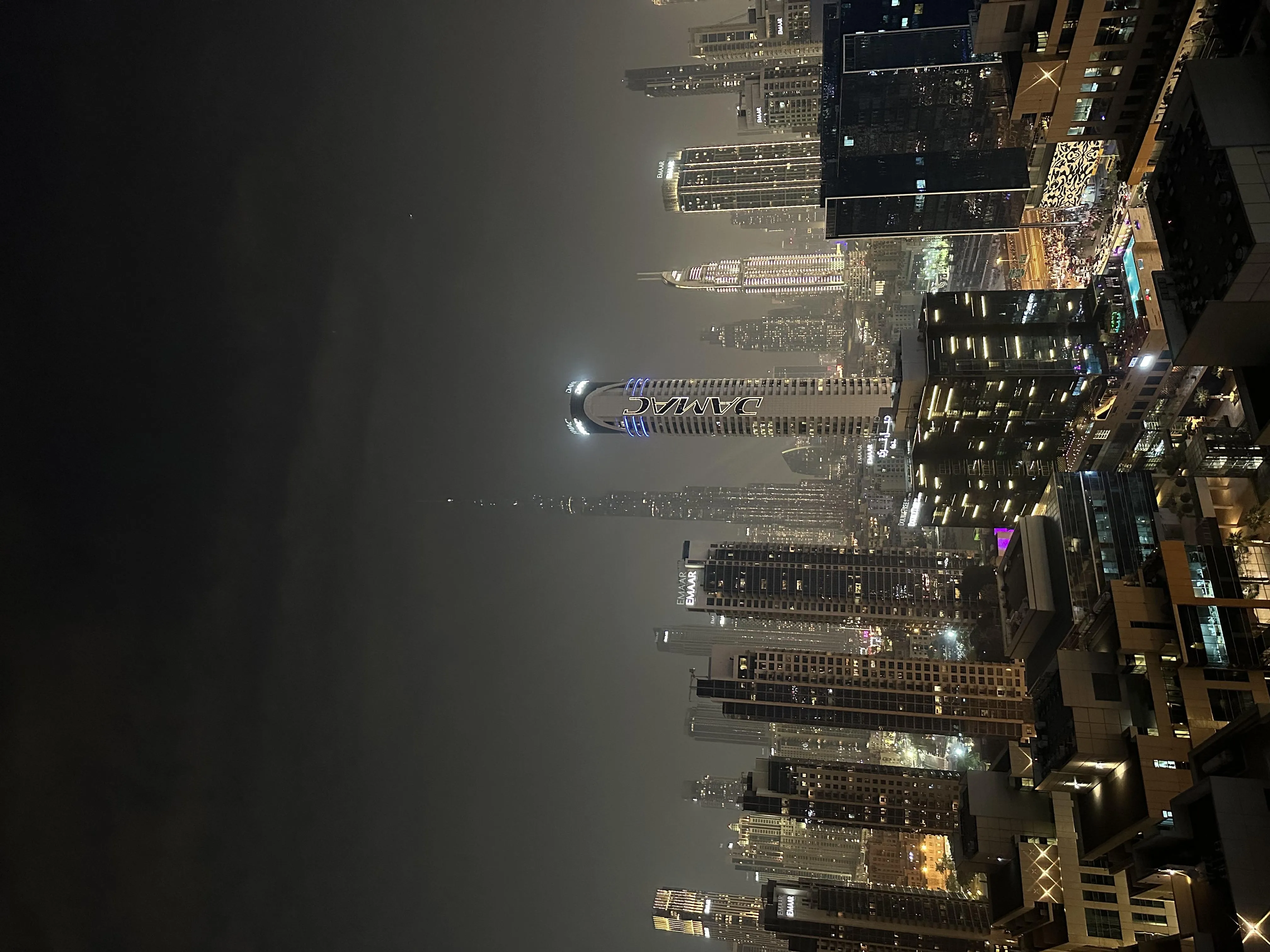 Stunning City Skyline at Night with Foggy Atmosphere