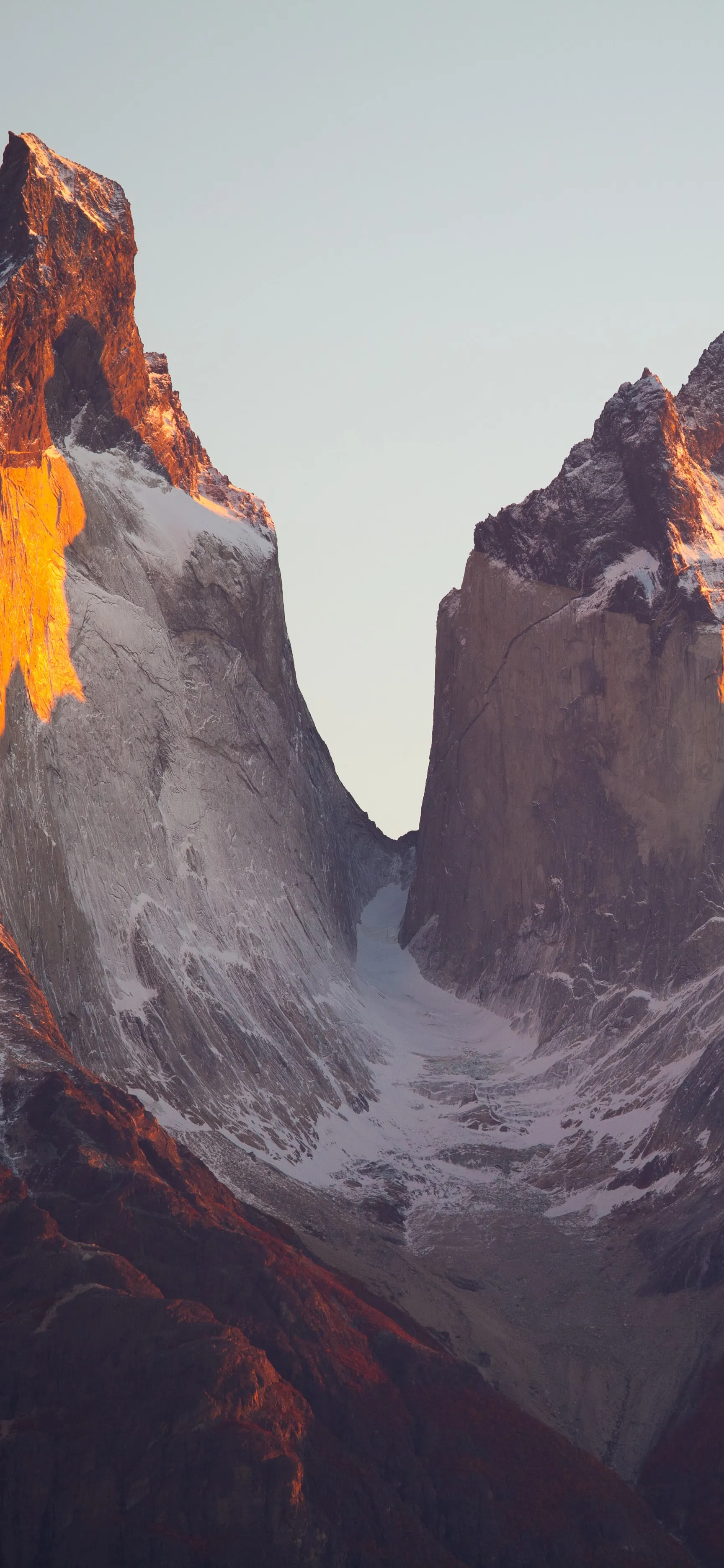 Stunning Mountain Cliff Scene with Warm Sunset Light