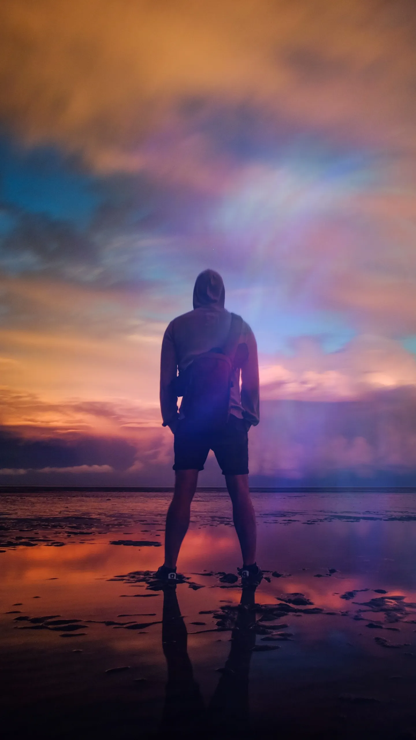 Stunning Silhouette of Man Standing at Sunset on Beach