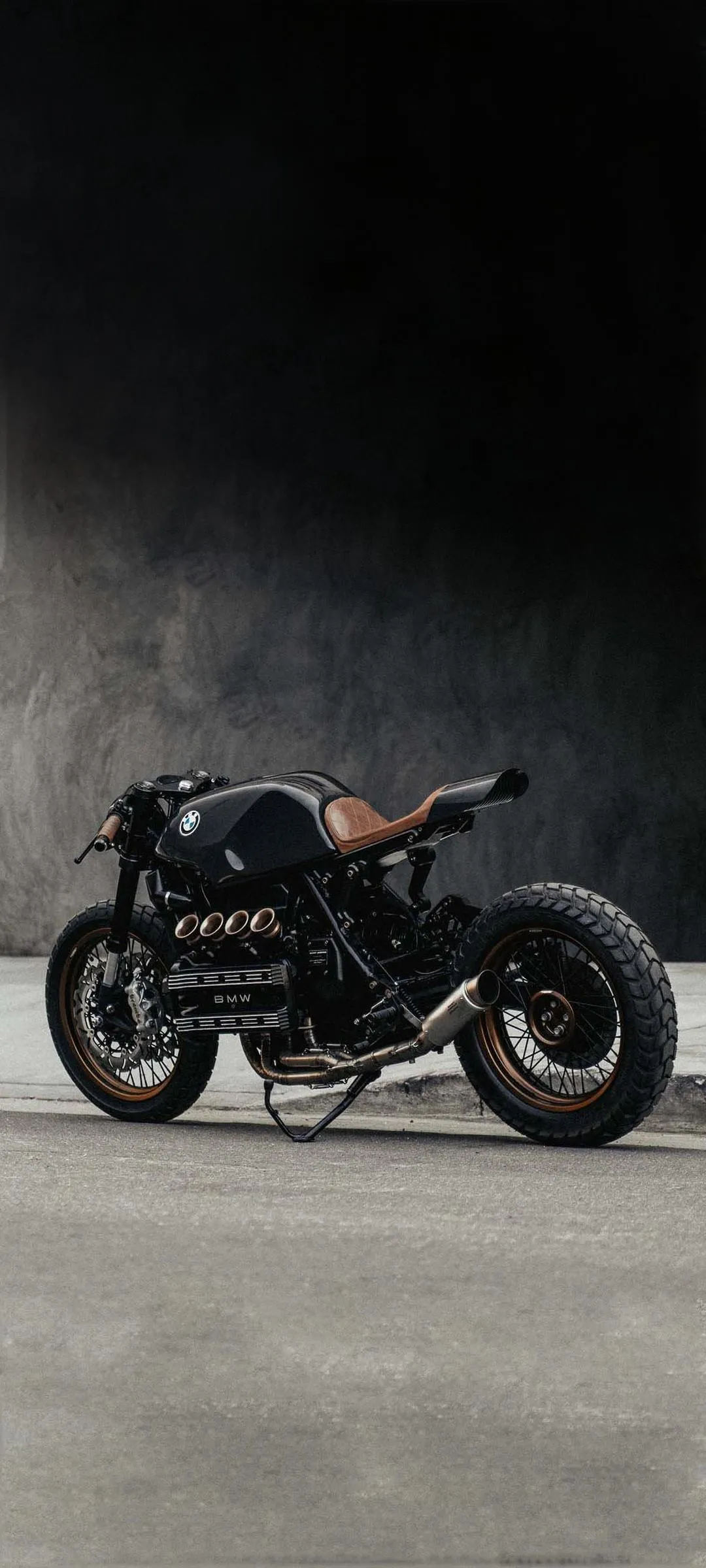 Stylish Black Motorcycle on Foggy Concrete Background