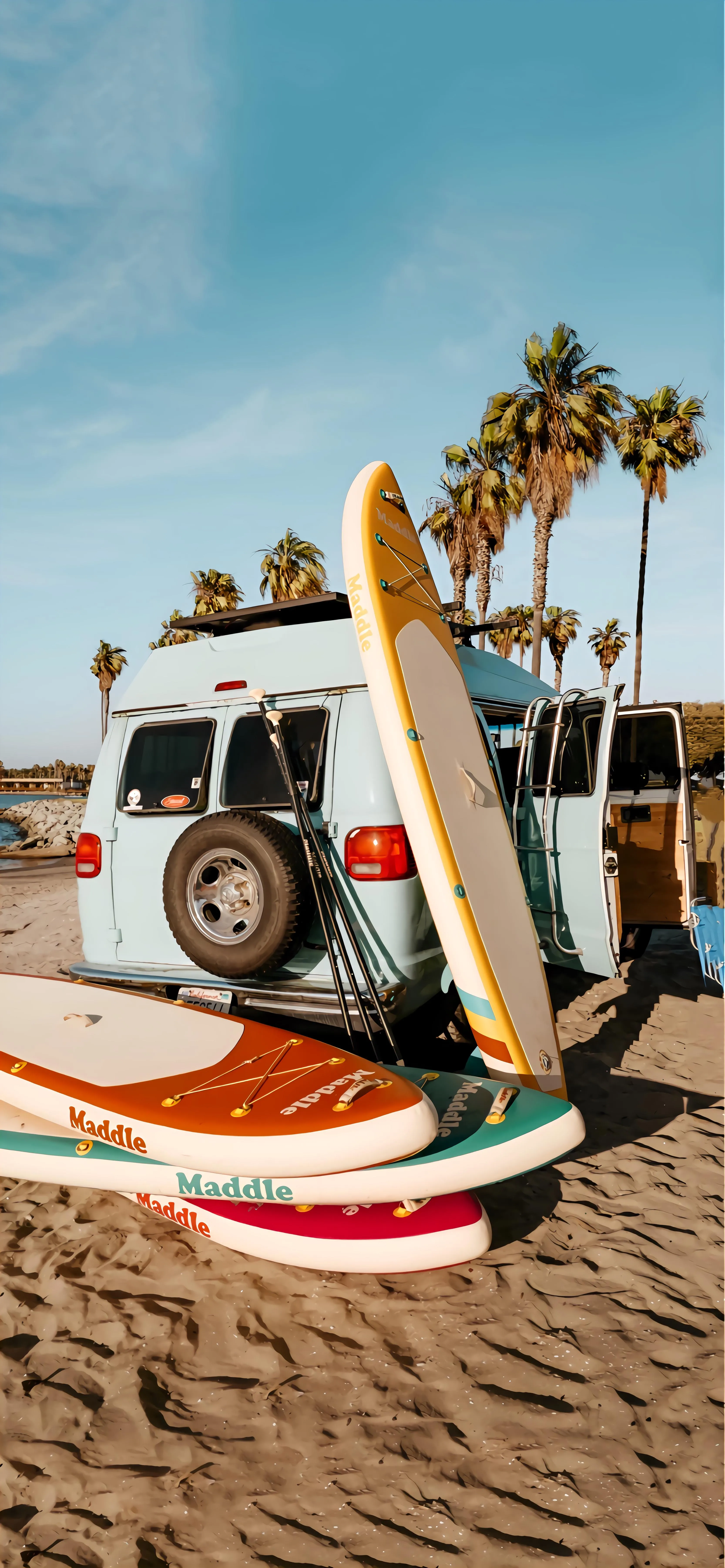Summer Beach Scene with Surfboard and Classic Van Image