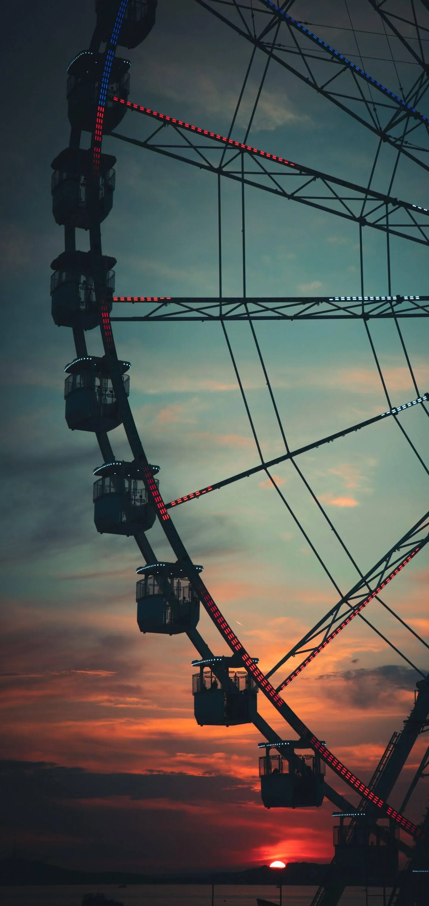 Sunset Ferris Wheel View Mobile Wallpaper with Sky Glow