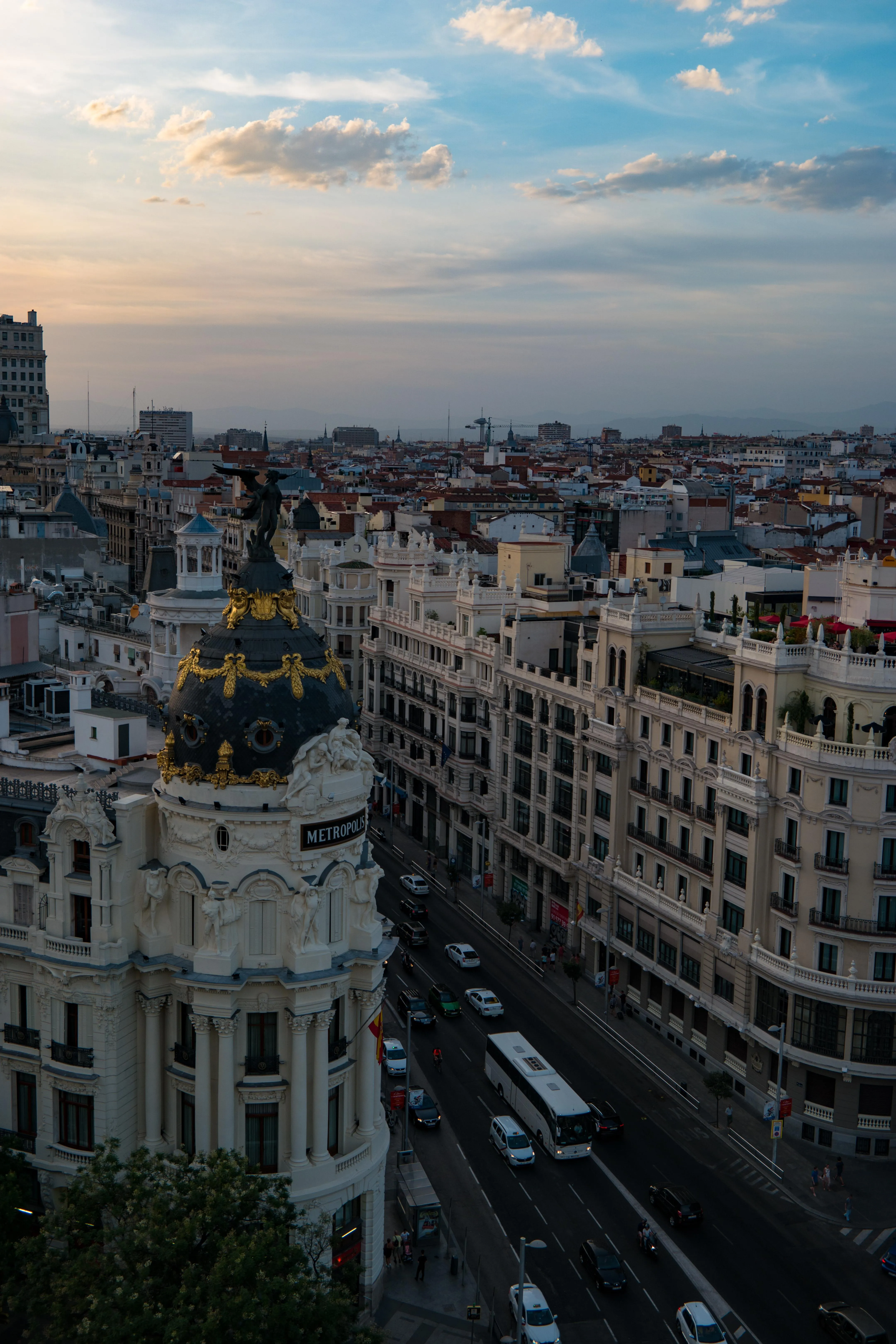 Sunset Over Cityscape with Buildings and Roads Image