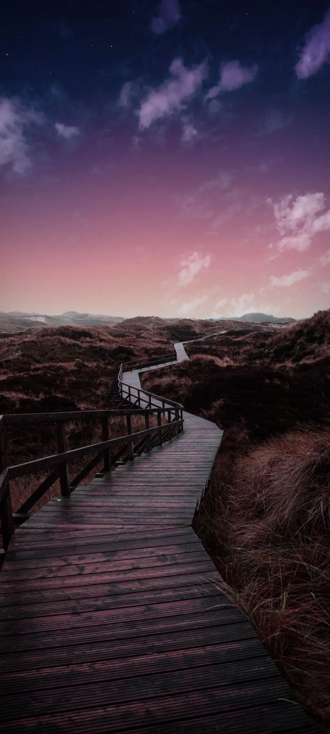 Sunset Over Wooden Pier with Reflective Water Wallpaper
