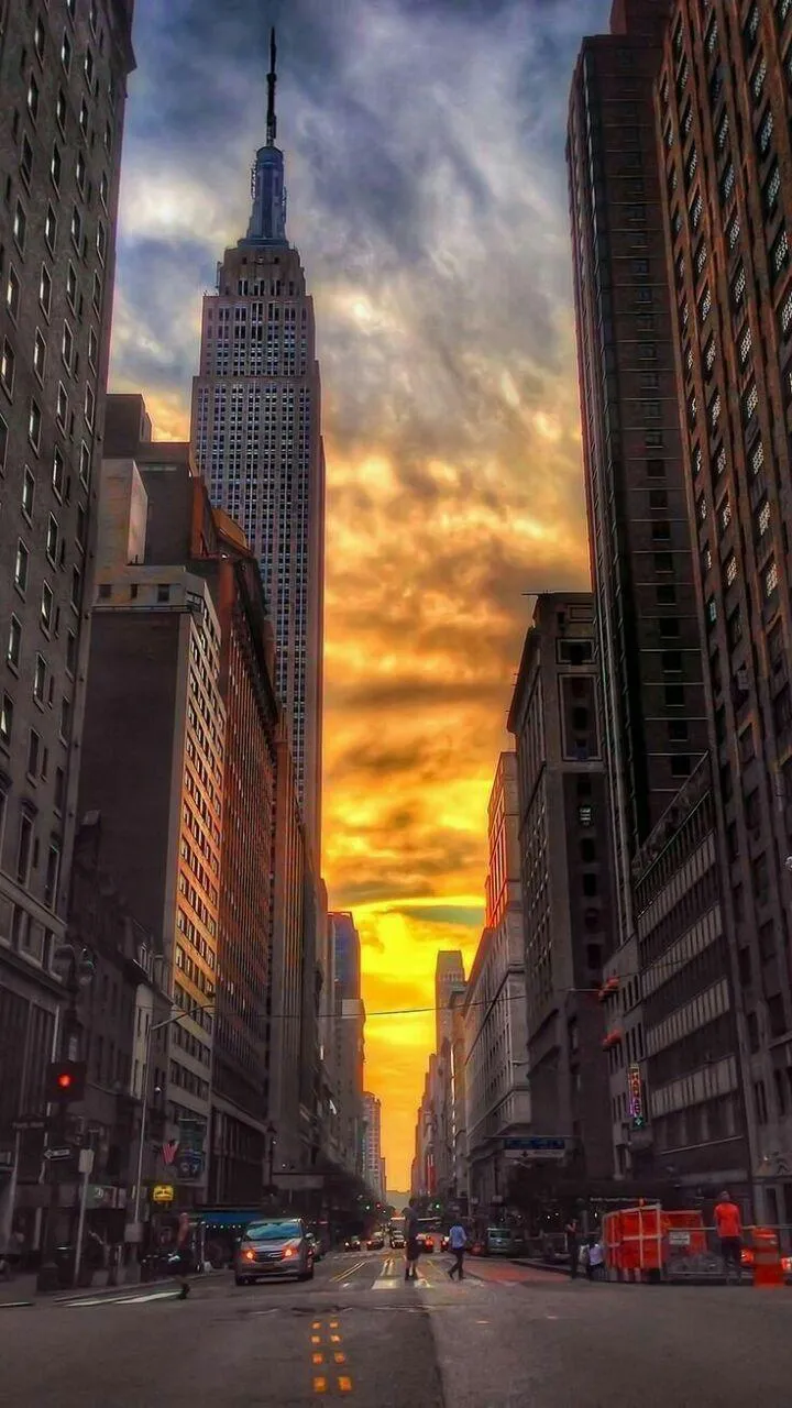 Sunset View of City Street with Golden Light Glow Wallpaper