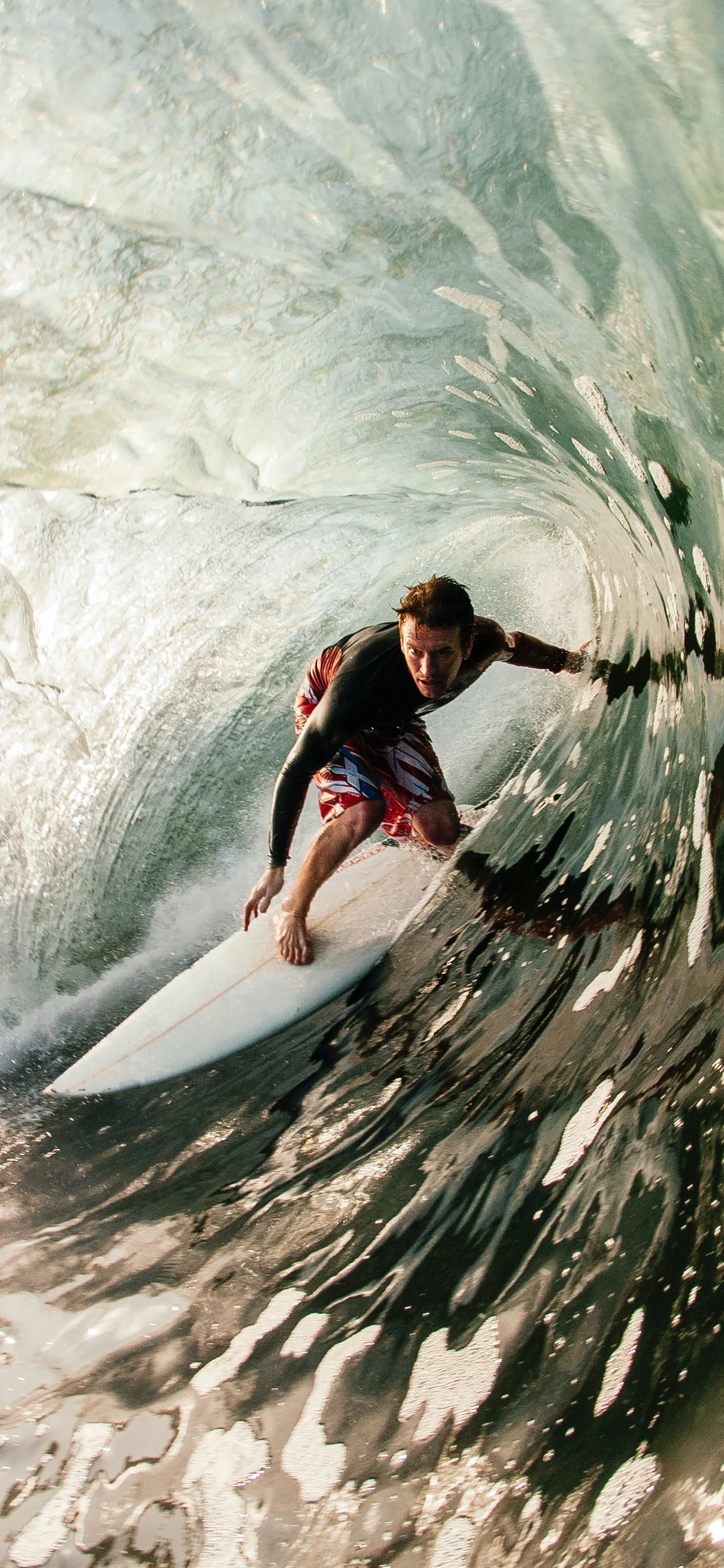 Surfer Riding a Big Ocean Wave at Sunrise HD Image for Mobile