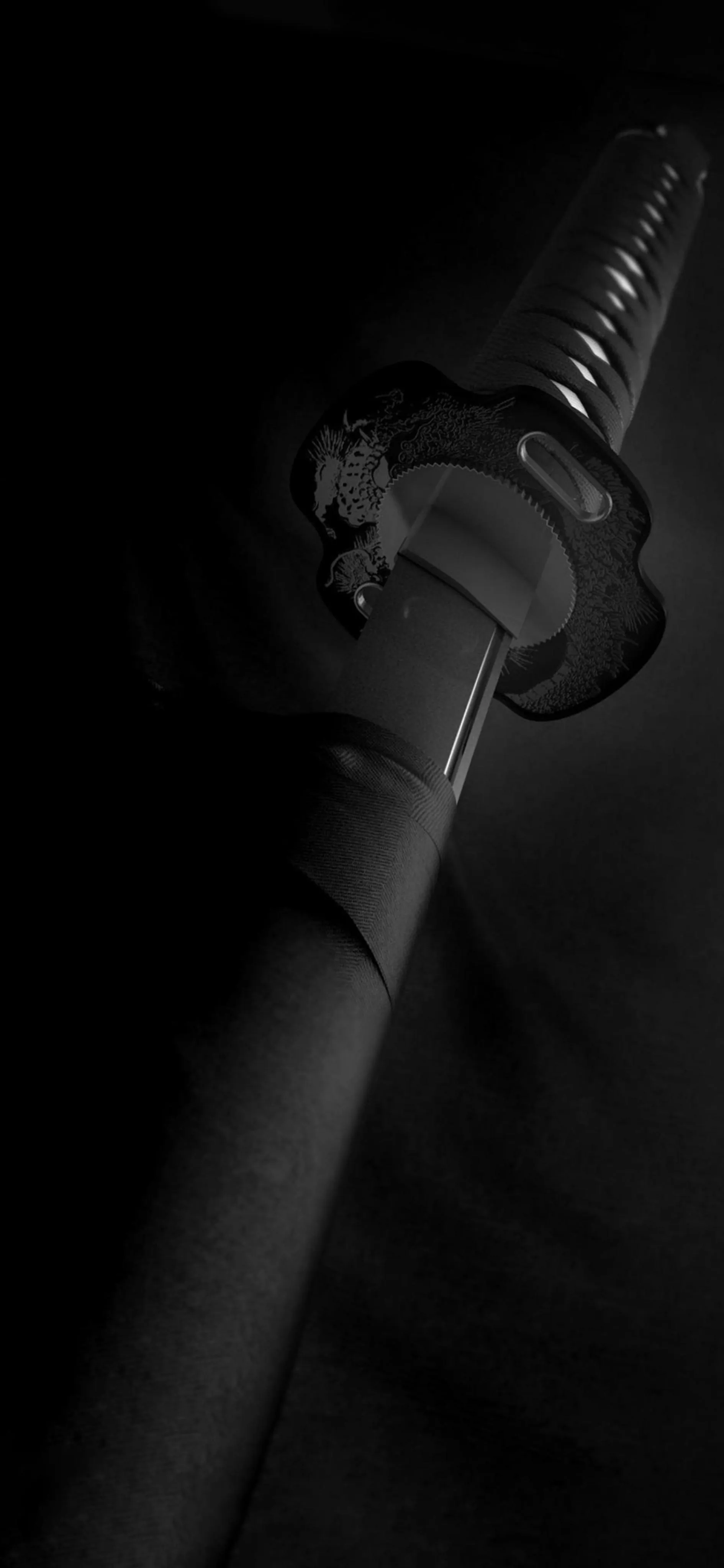 Sword Lit Dramatically in Shadowy Dark Background Wallpaper