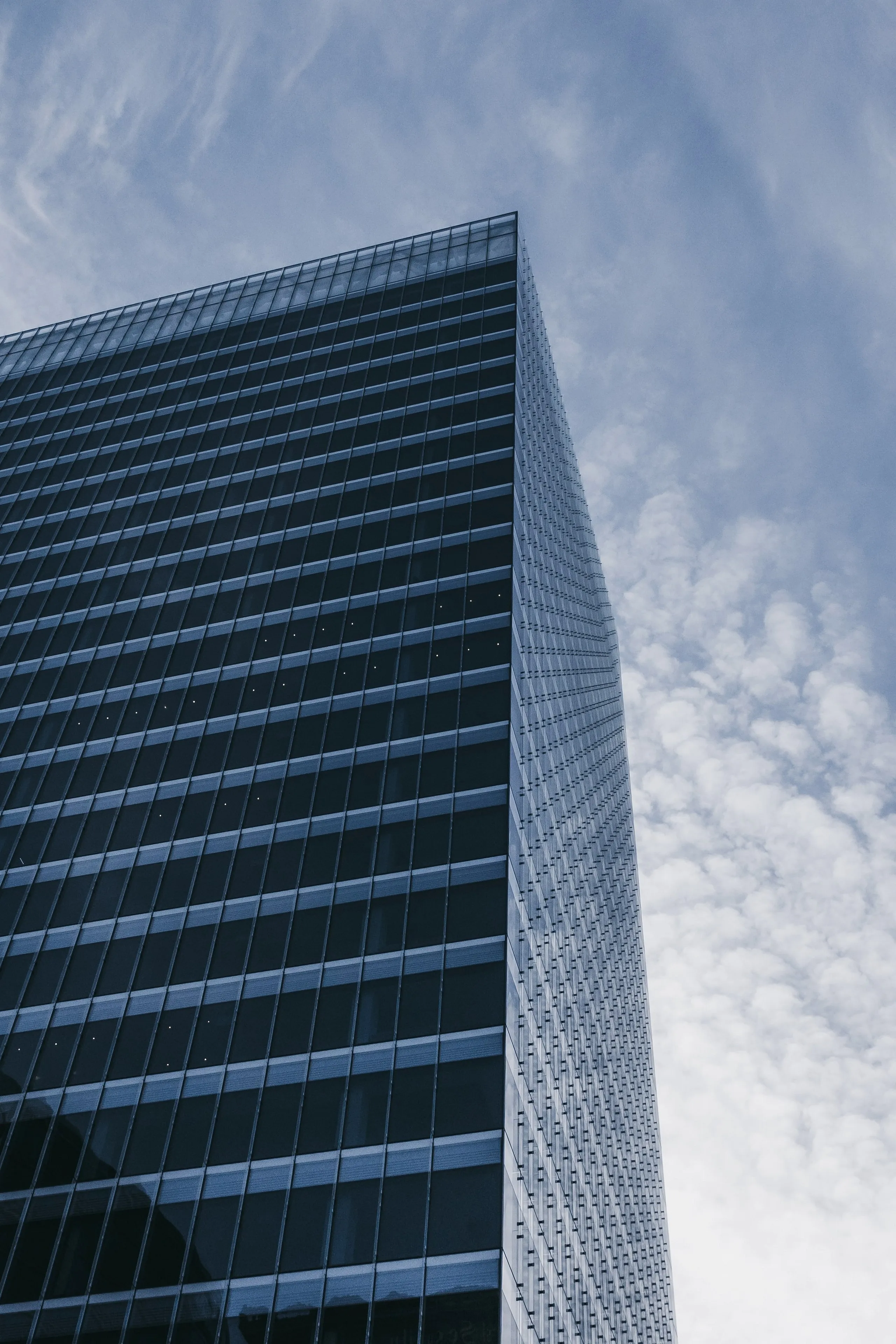 Tall Corporate Building Under Clear Blue Sky Wallpaper 4K