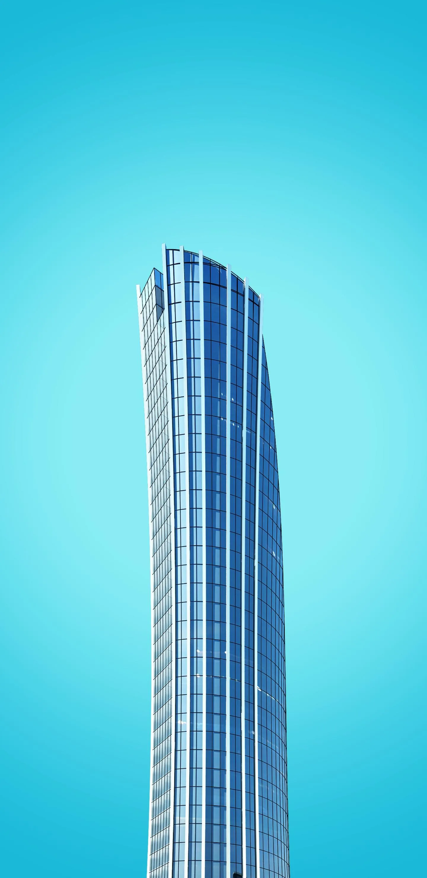 Tall Modern Blue Skyscraper Centered On Cyan Background