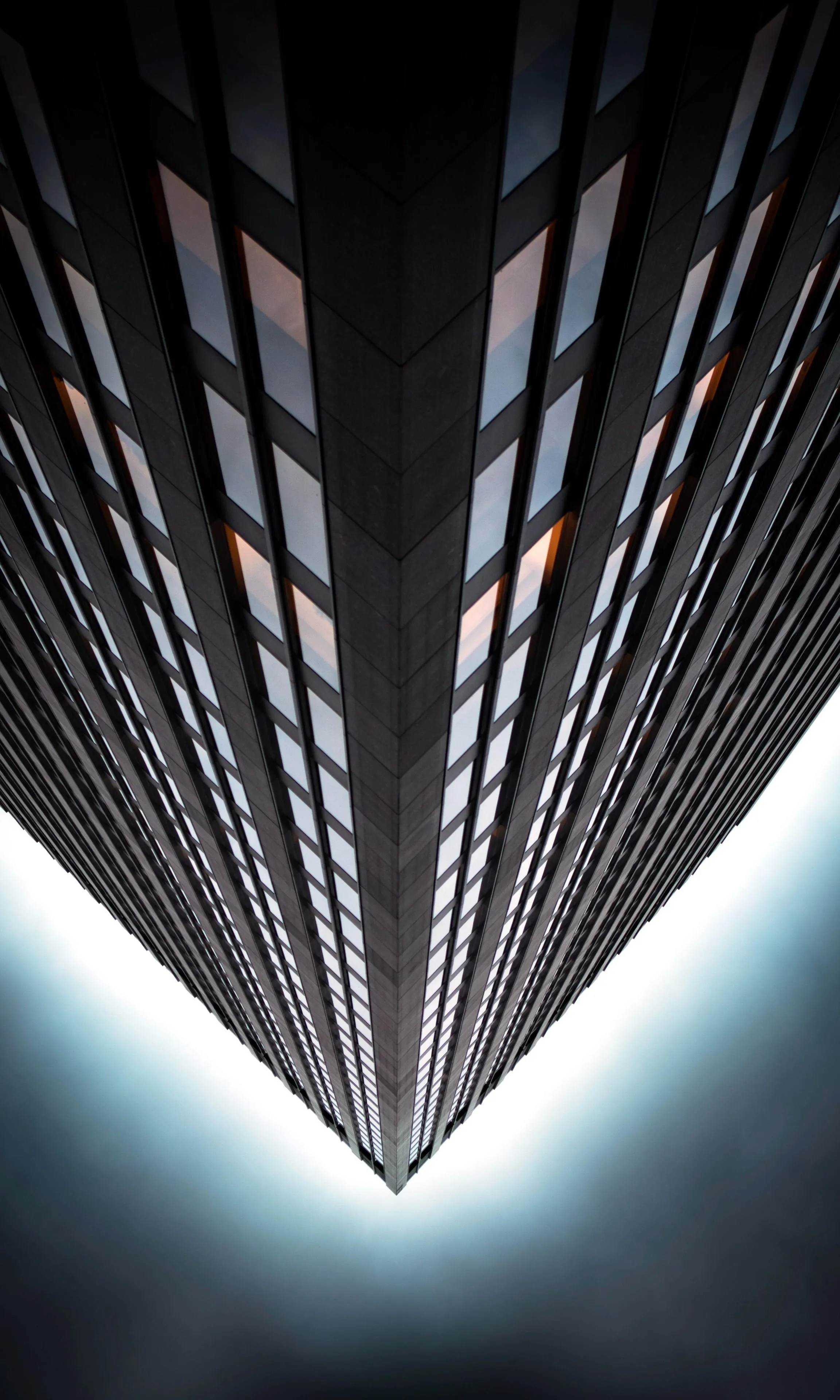 Tall Modern Building with Reflective Glass Windows Image