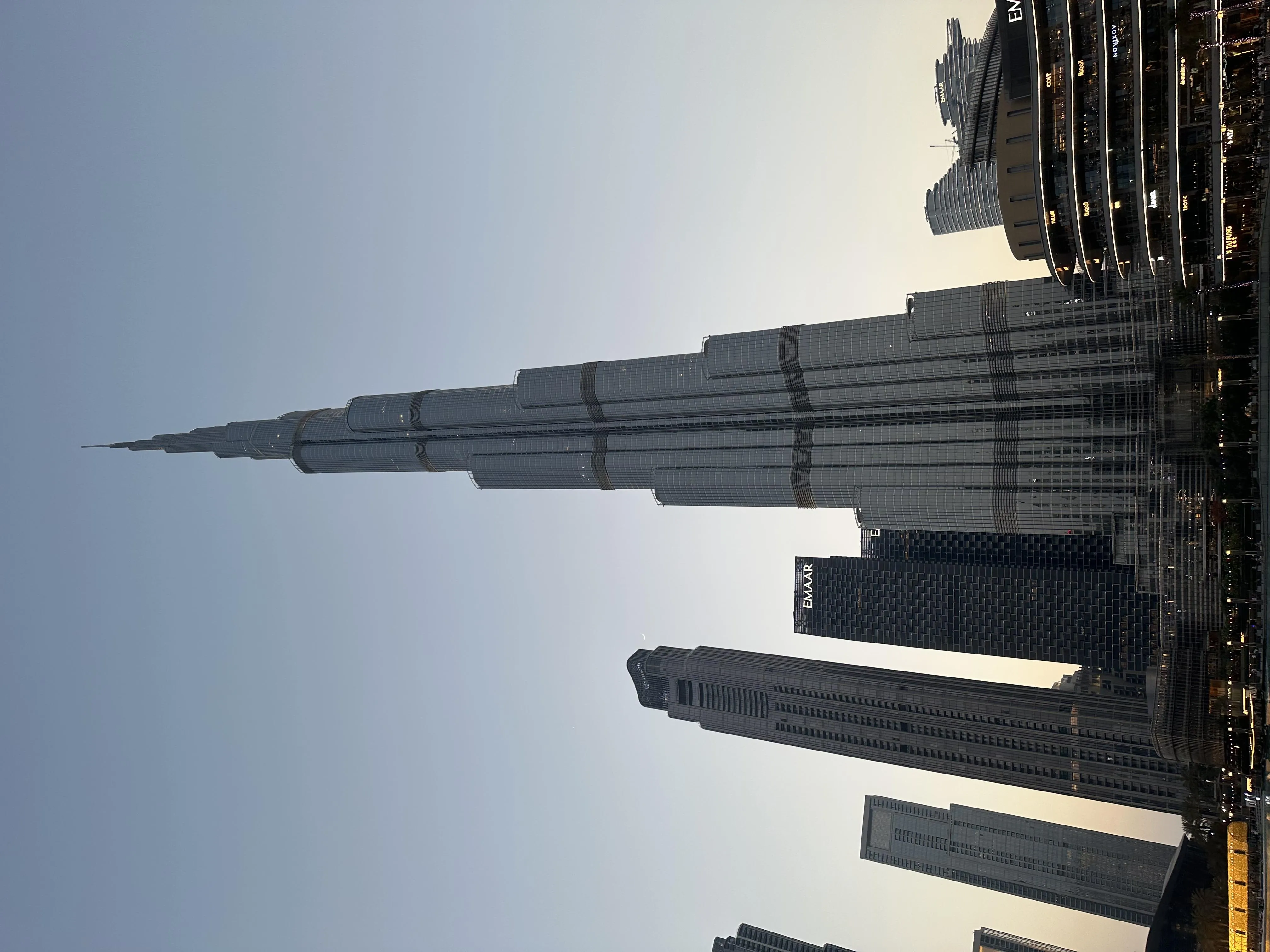 Tall Skyscraper with Modern Design in Blue Sky View