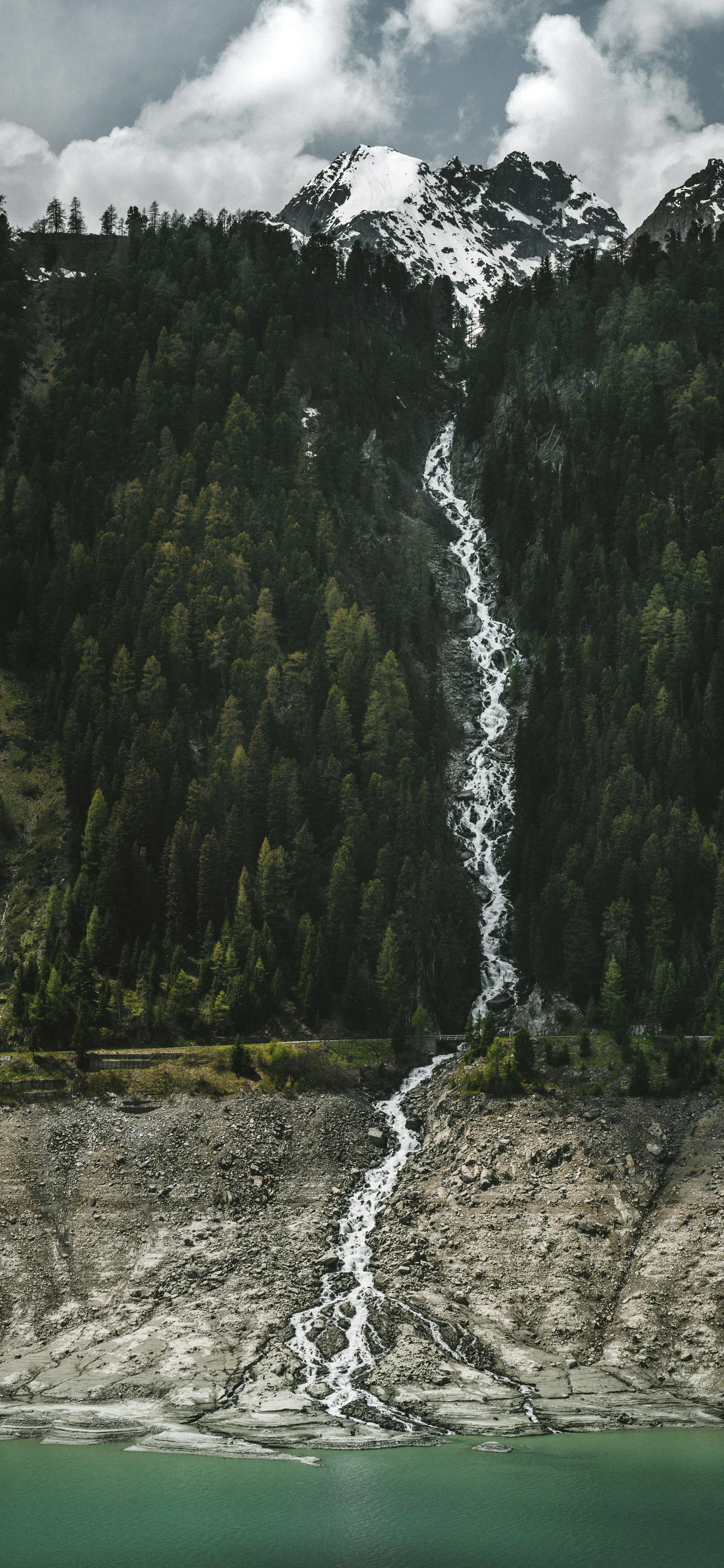 Tall Waterfall in Forest with Rocky Stream Below Image HD