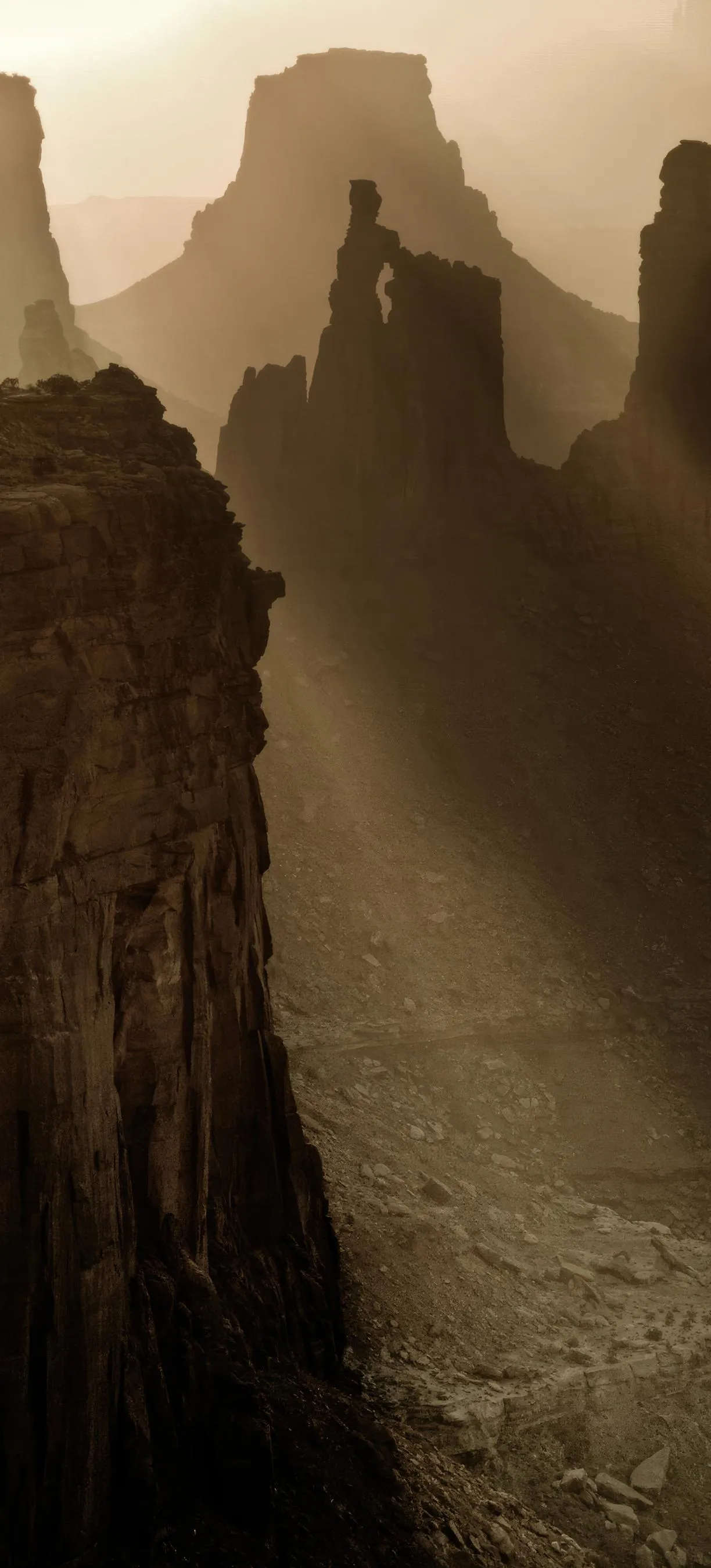 Towering Mountain Cliff with Golden Hour Light in Nature