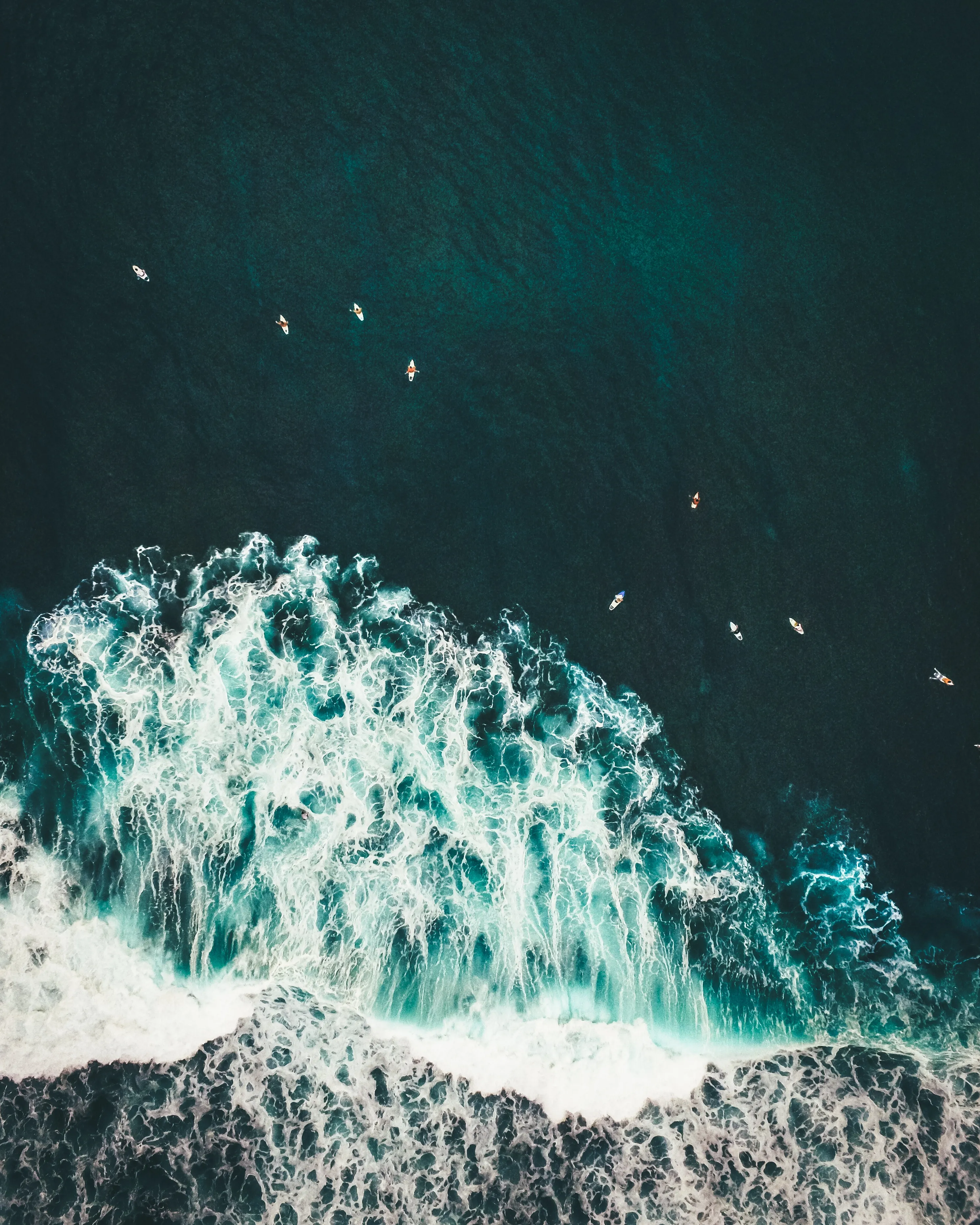 Turquoise Ocean with White Waves from Above Wallpaper
