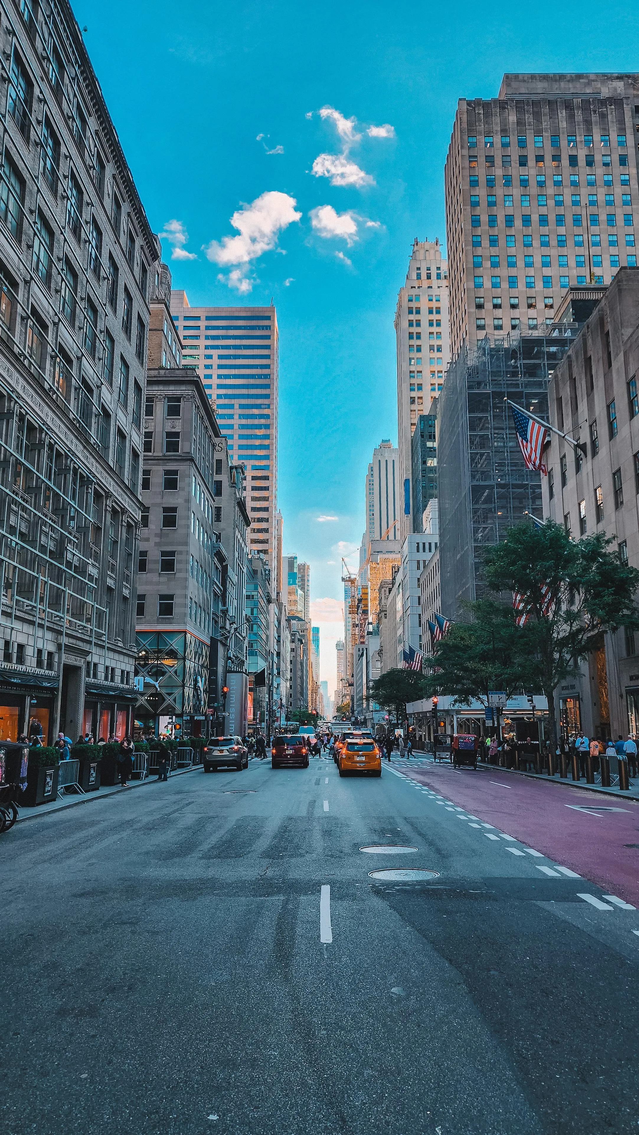 Urban Street View with Tall Buildings and Clear Sky Image