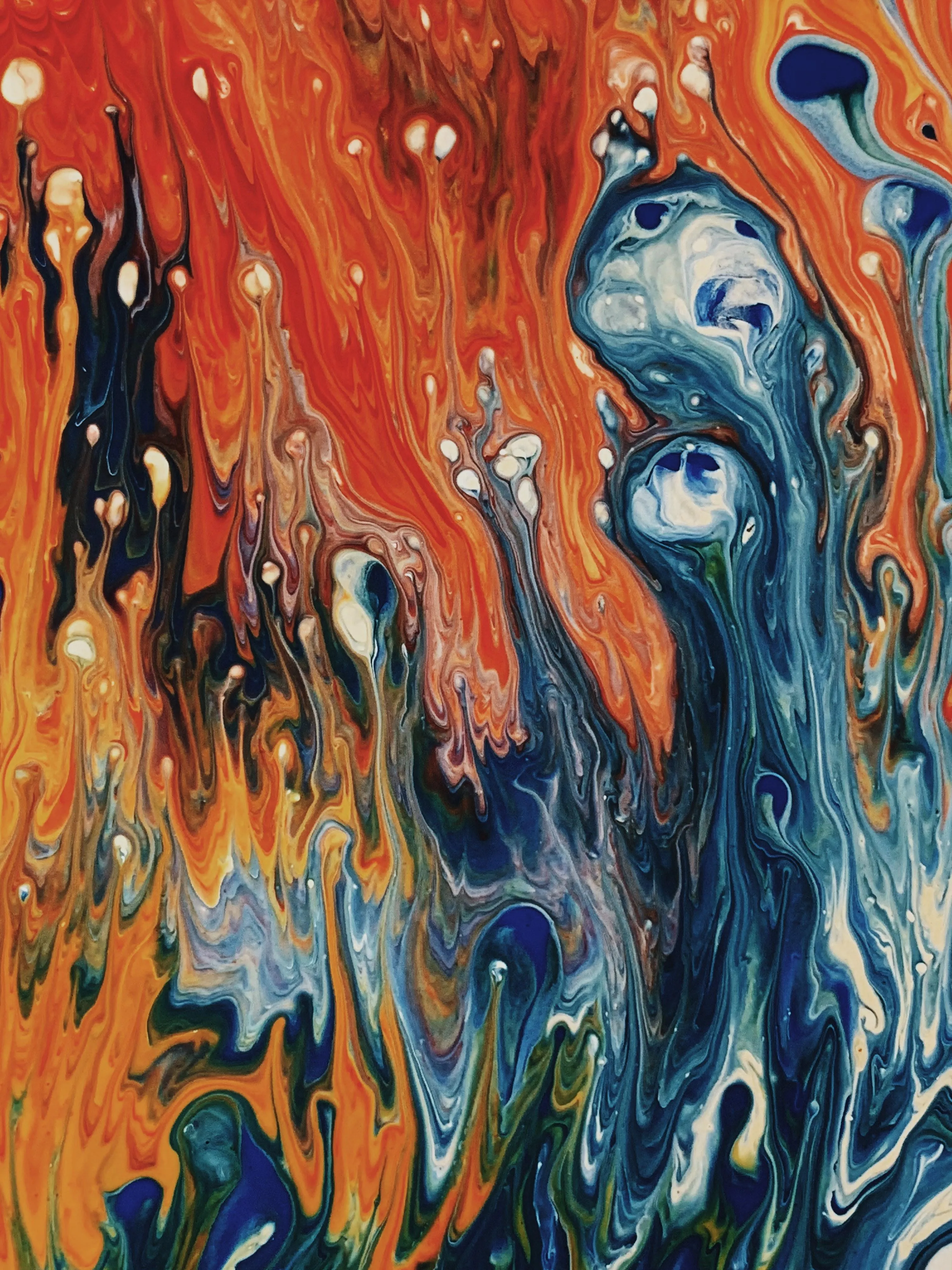 Vibrant Blue and Orange Abstract Paint Flowing Together