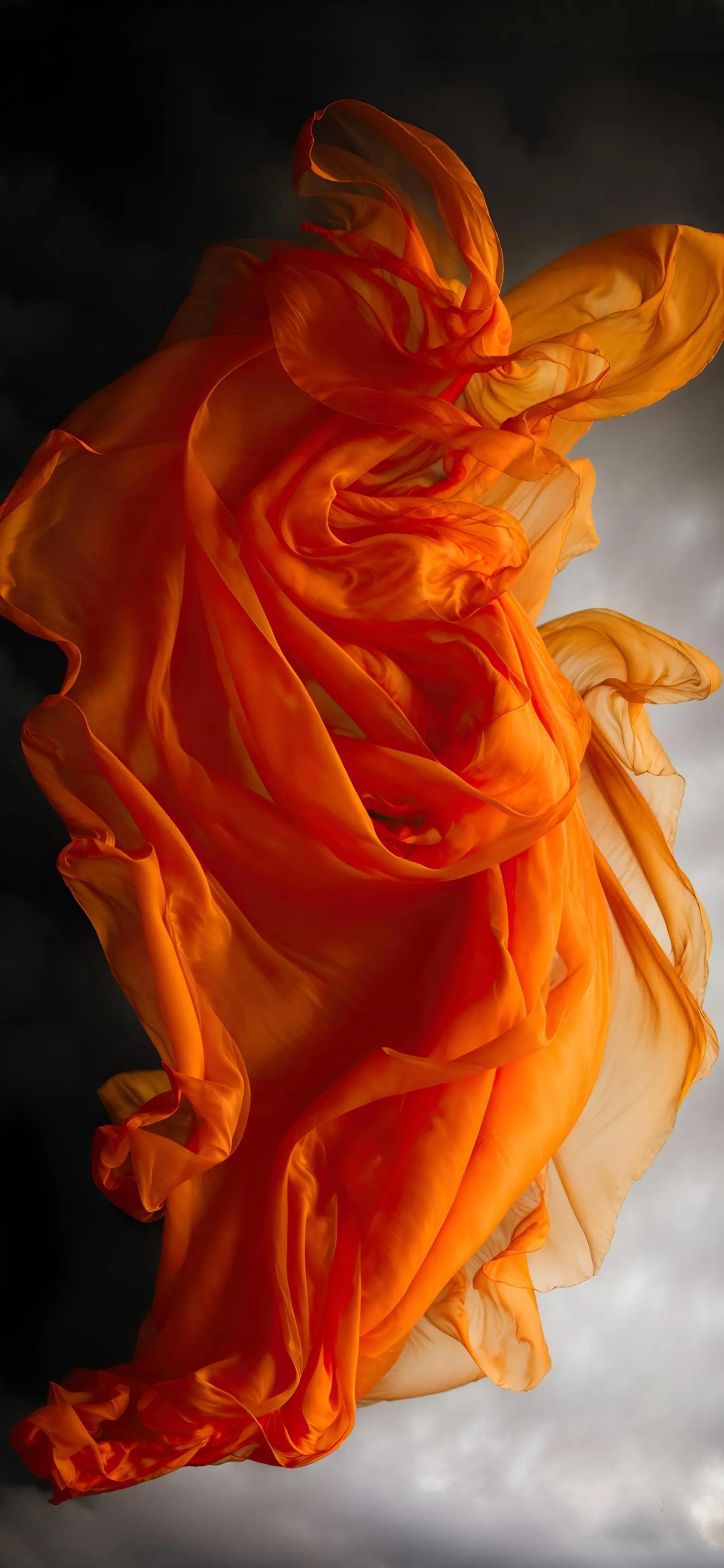Vibrant Orange Smoke Cloud Against Neutral Background