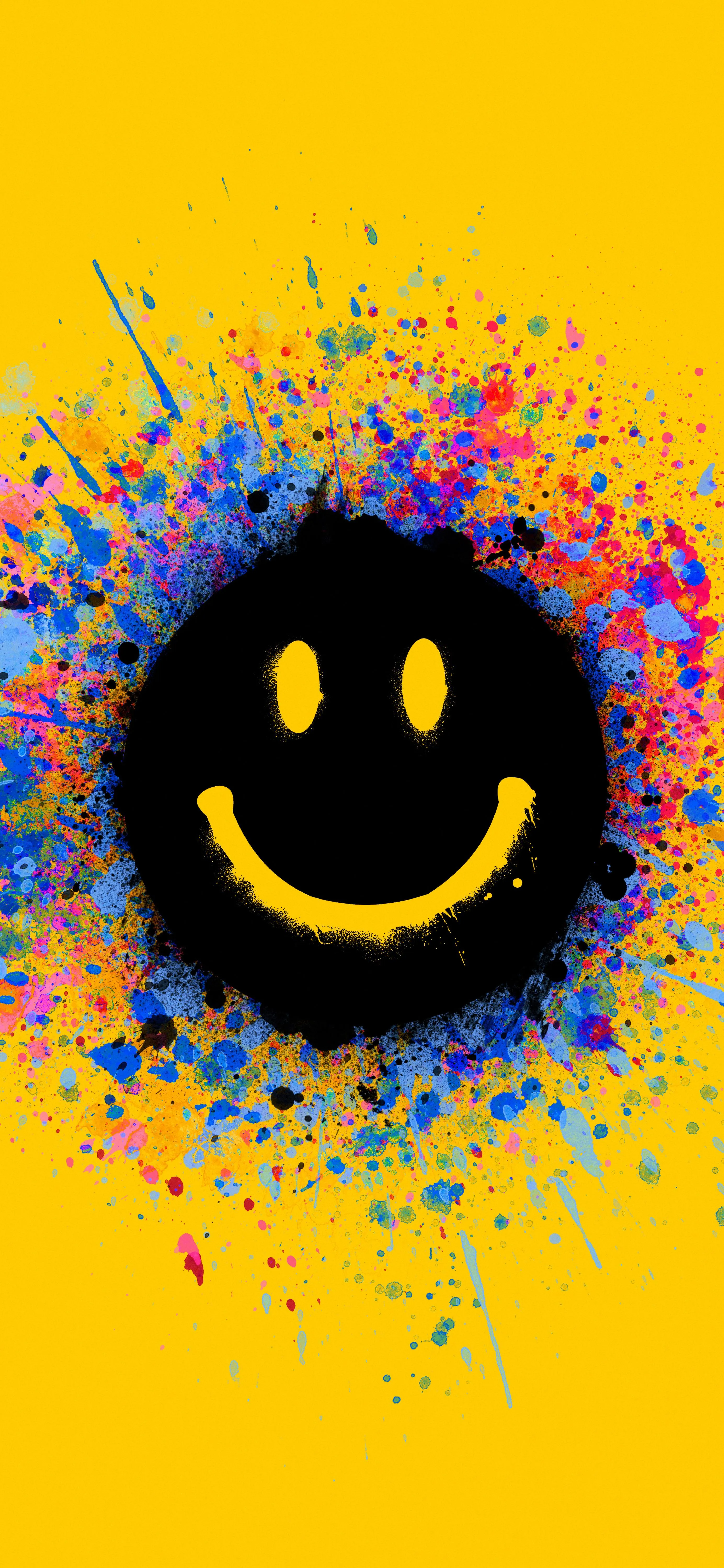 Vibrant Smiley Face on Bright Yellow Background Wallpaper