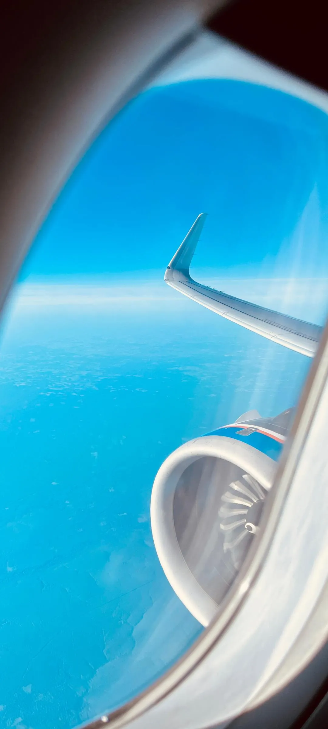 View from Airplane Window Showing Wing and Engine Image