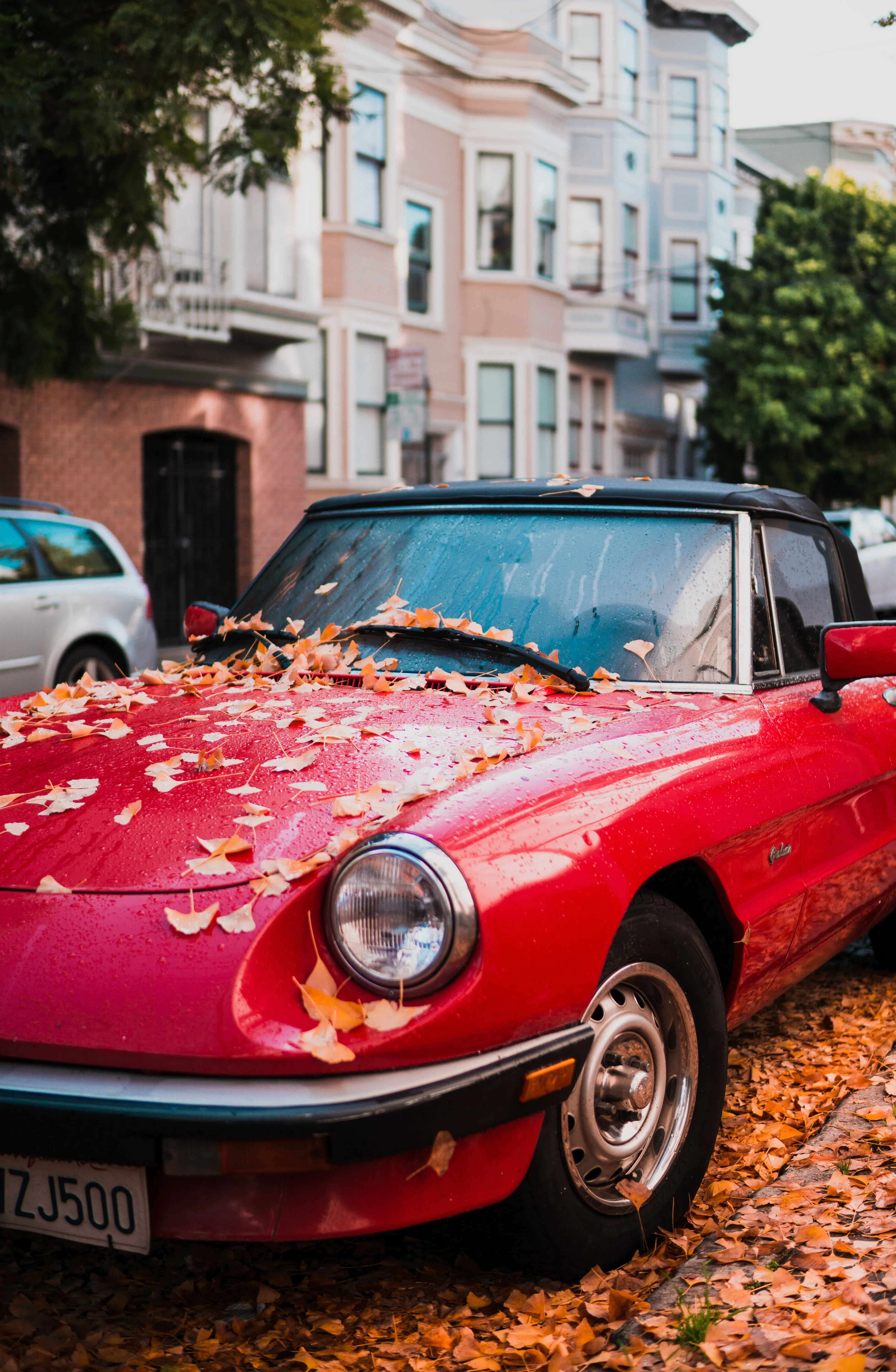 Vintage Car on Quiet Street in Morning Light Wallpaper