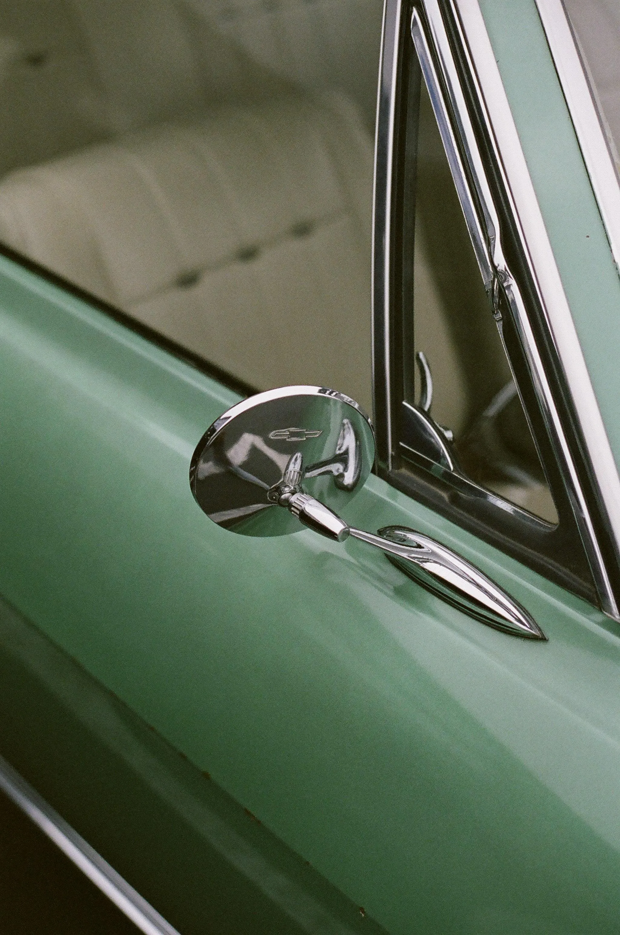 Vintage Green Car Mirror Captured in Soft Evening Light