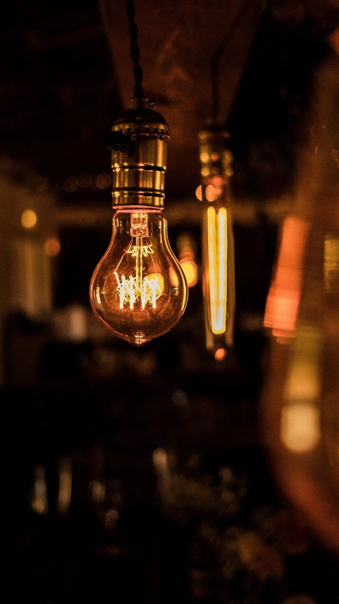 Vintage Hanging Light Bulbs In Warm Cozy Ambience Image