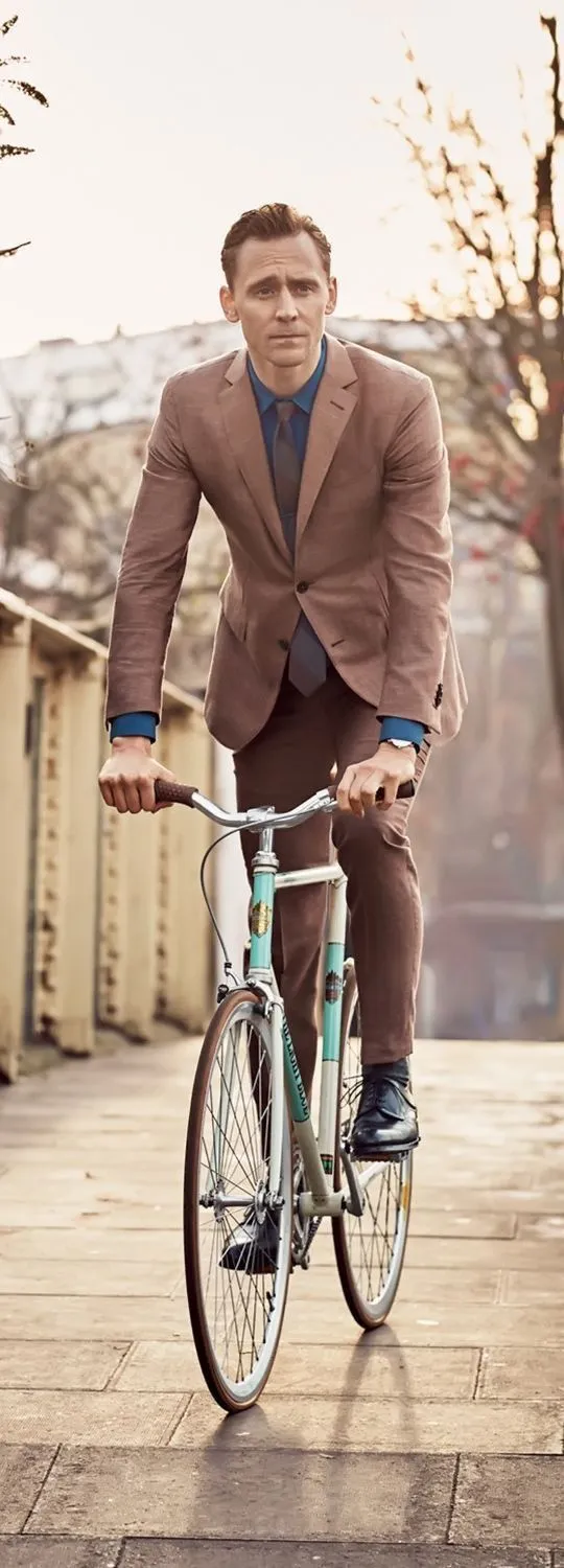 Vintage Style Image of a Man Riding a Bicycle Wallpaper