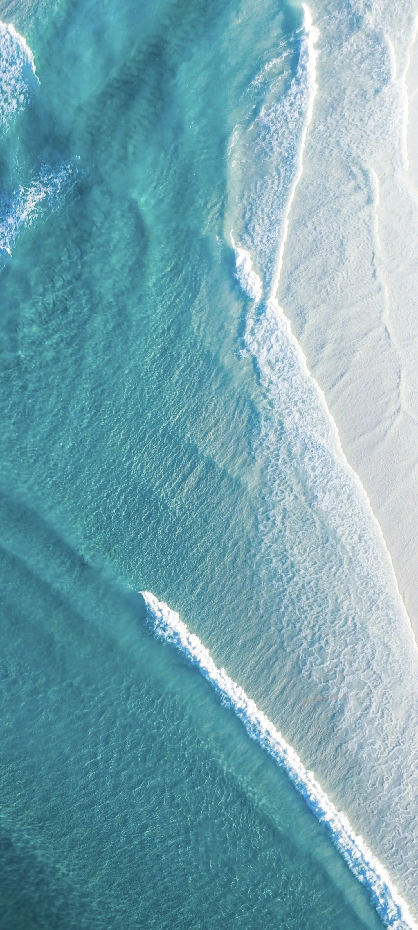 Wallpaper of Aerial View of Ocean Waves Crashing on Sand