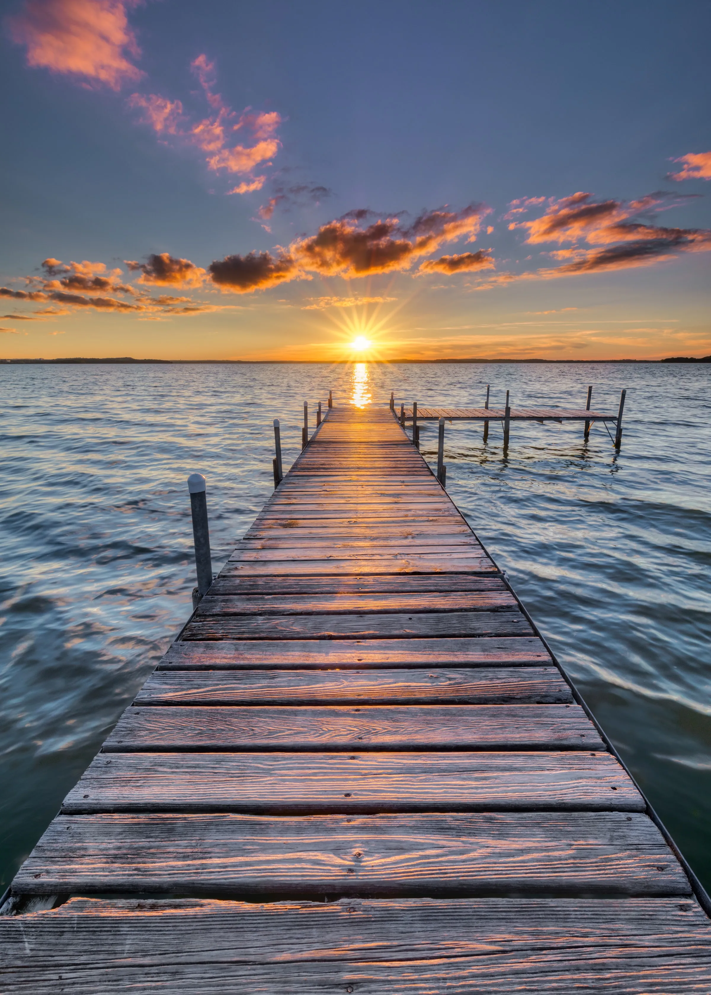 Wallpaper of Wooden Pier Leading to Ocean Under Sunrise Sky
