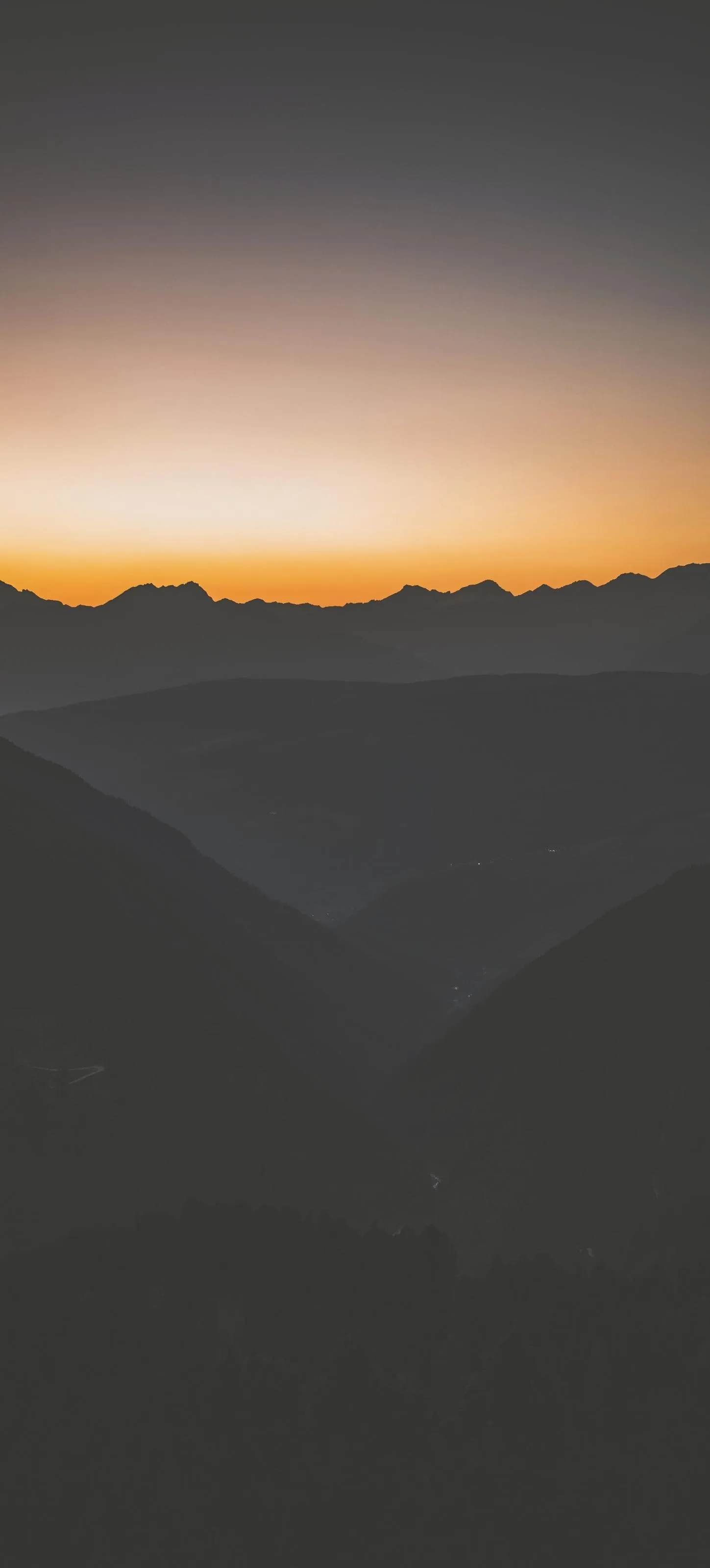 Warm Mountain Sunset Horizon with Calm Golden Light