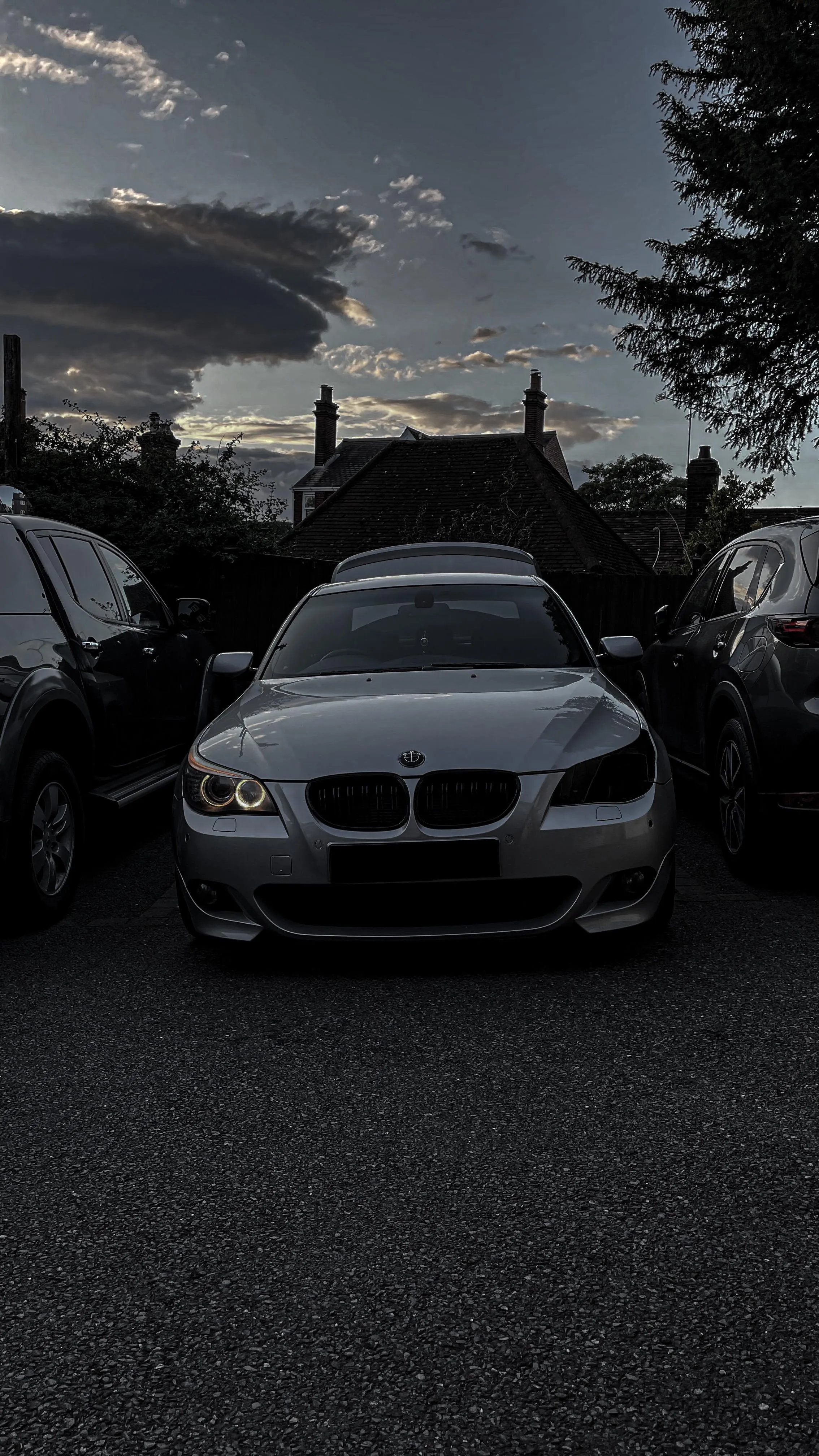 White Luxury Car Parked on Street at Sunset Hour Wallpaper