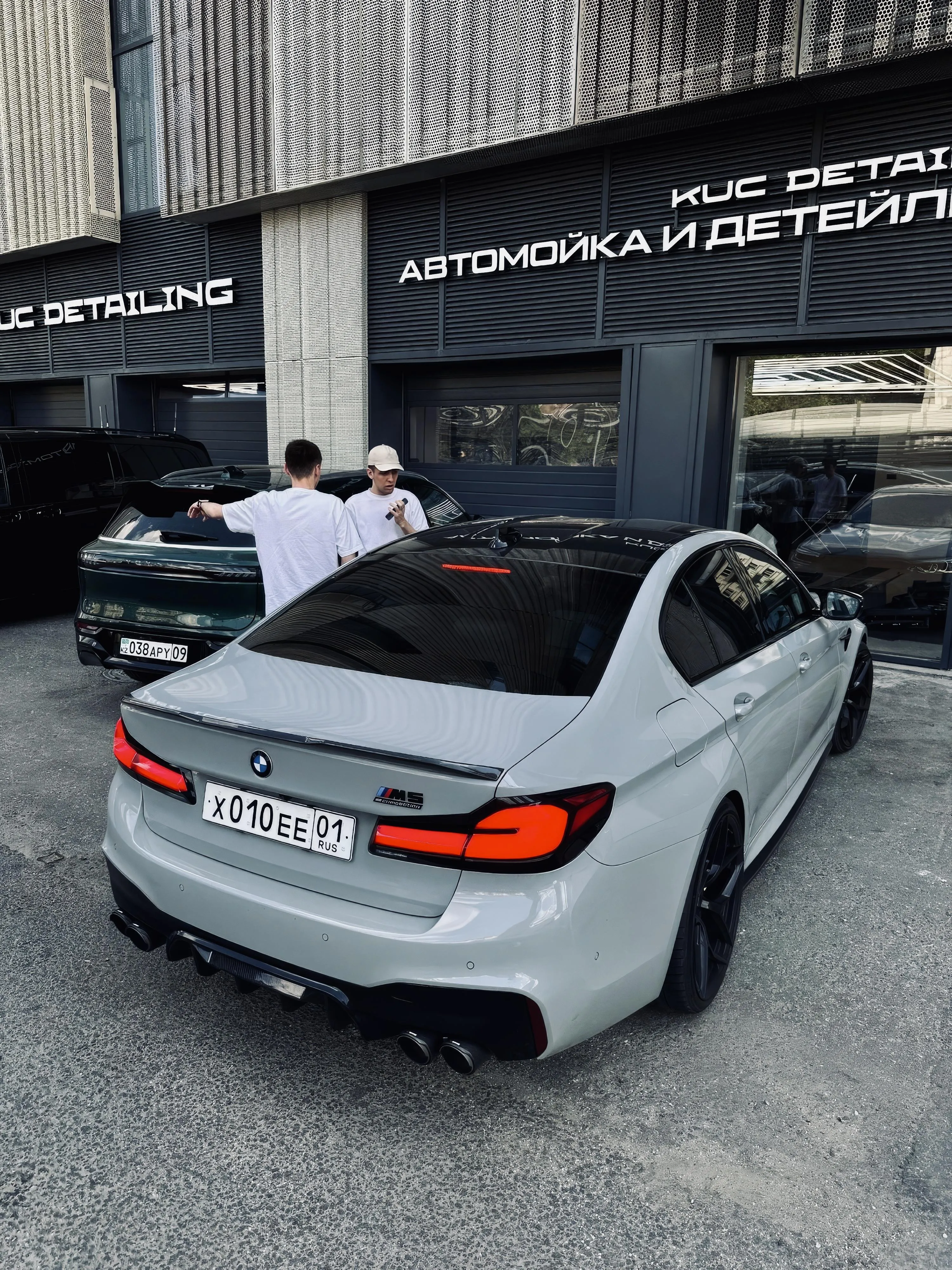 White Luxury Car Parked Outside Modern Building for Vivo