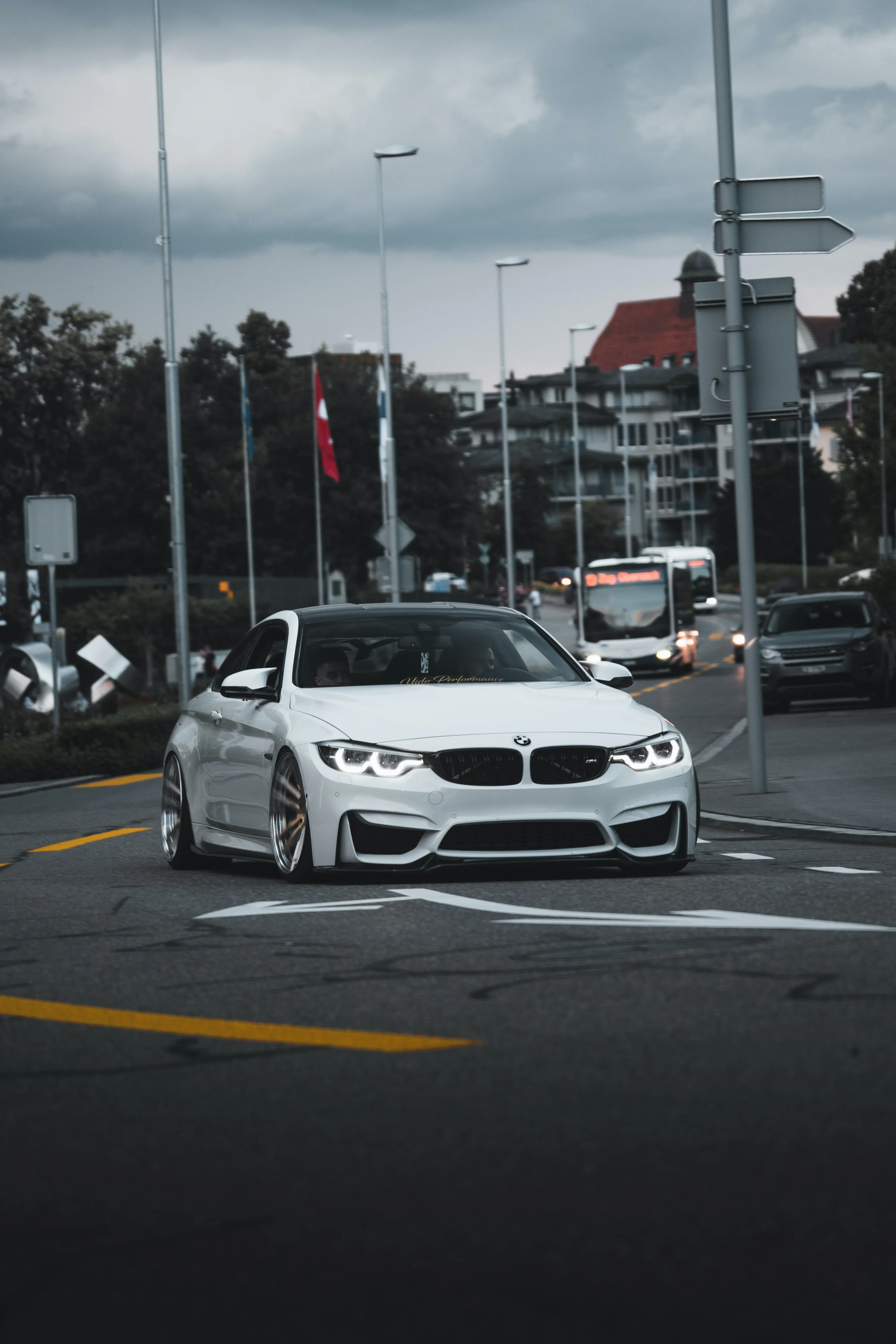 White Sports Car Parked Beside City Street Wallpaper