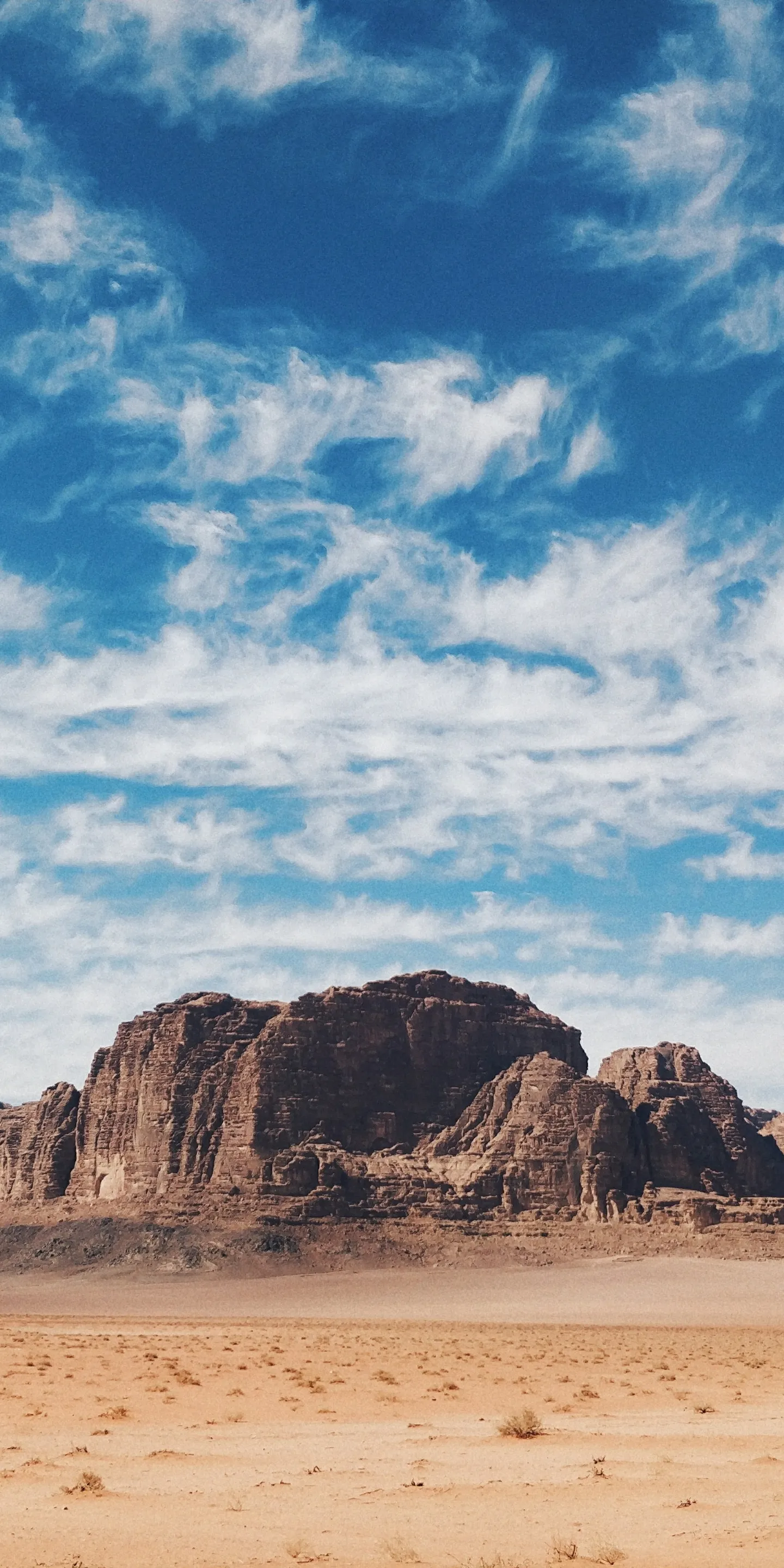 Wide Desert Landscape with Blue Sky and Rocky Hills
