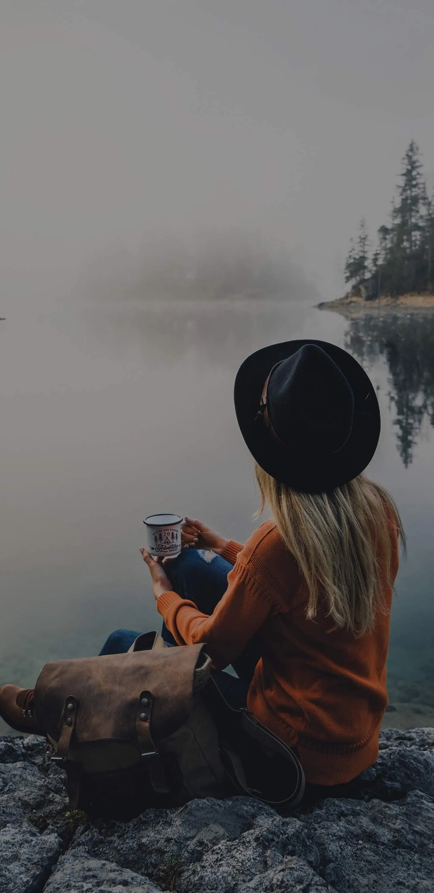 Woman Sitting Peacefully in Nature Mobile Wallpaper