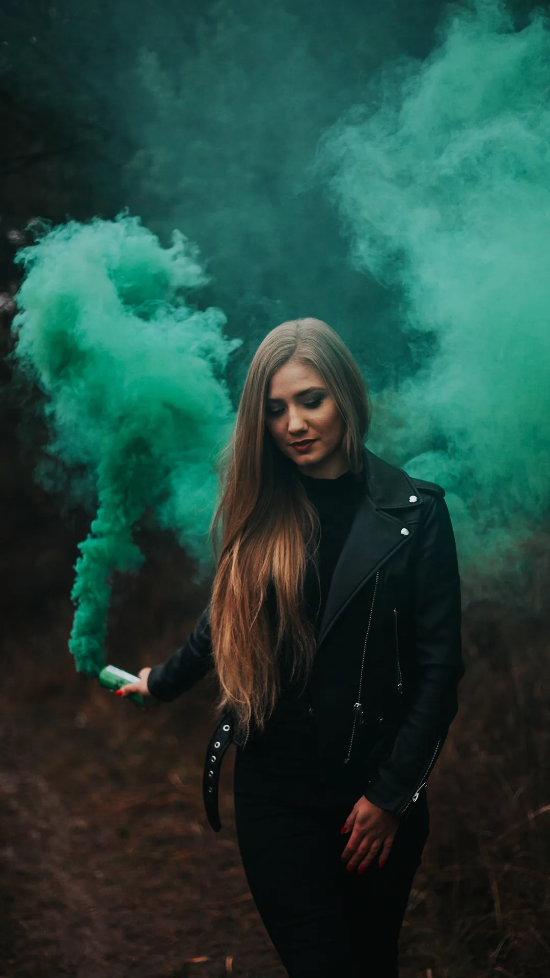 Woman Walking in Foggy Forest with Green Smoke Effect