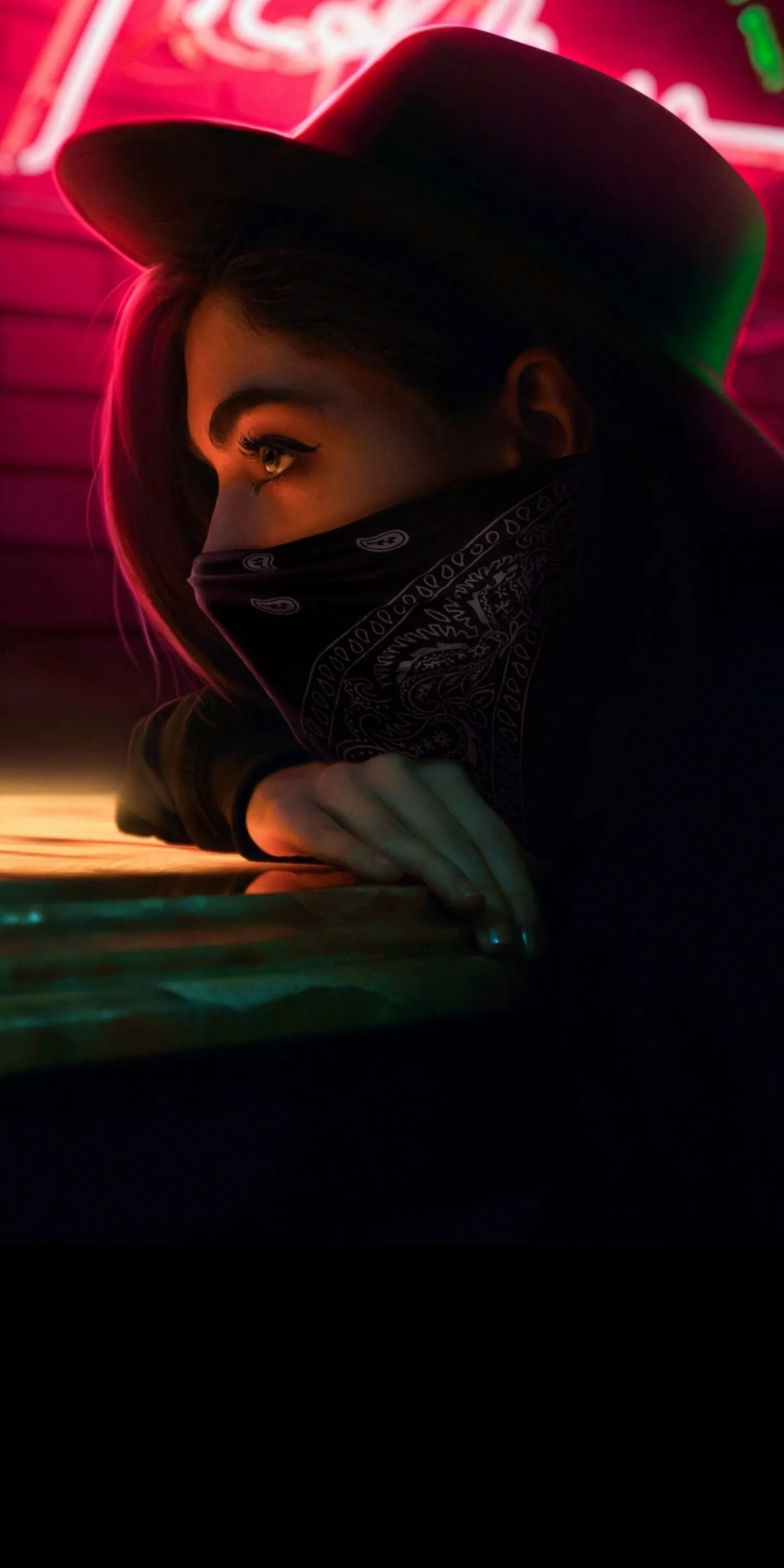 Woman Wearing Hat and Scarf Looking Thoughtful in Dark Light
