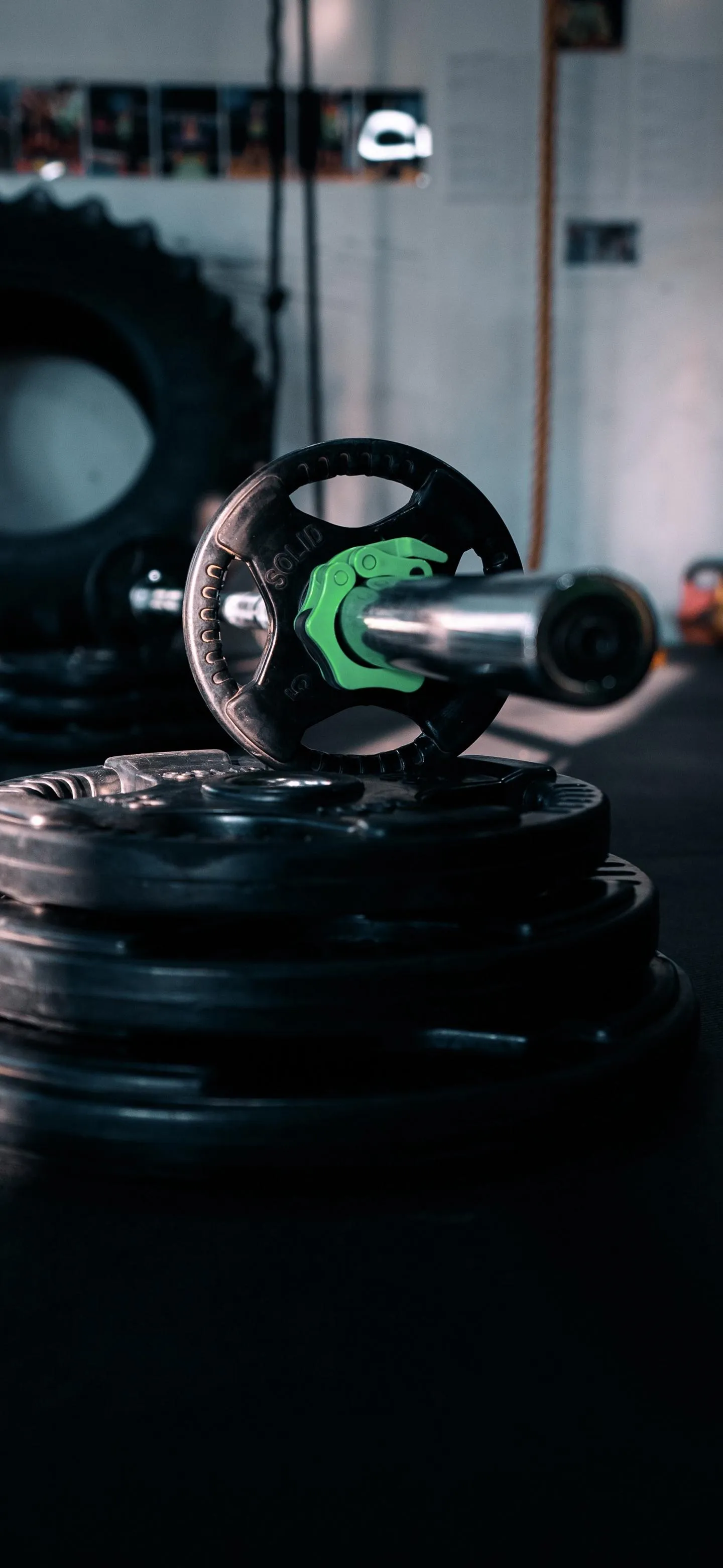 Workout Equipment and Gym Ambience in Focus Wallpaper