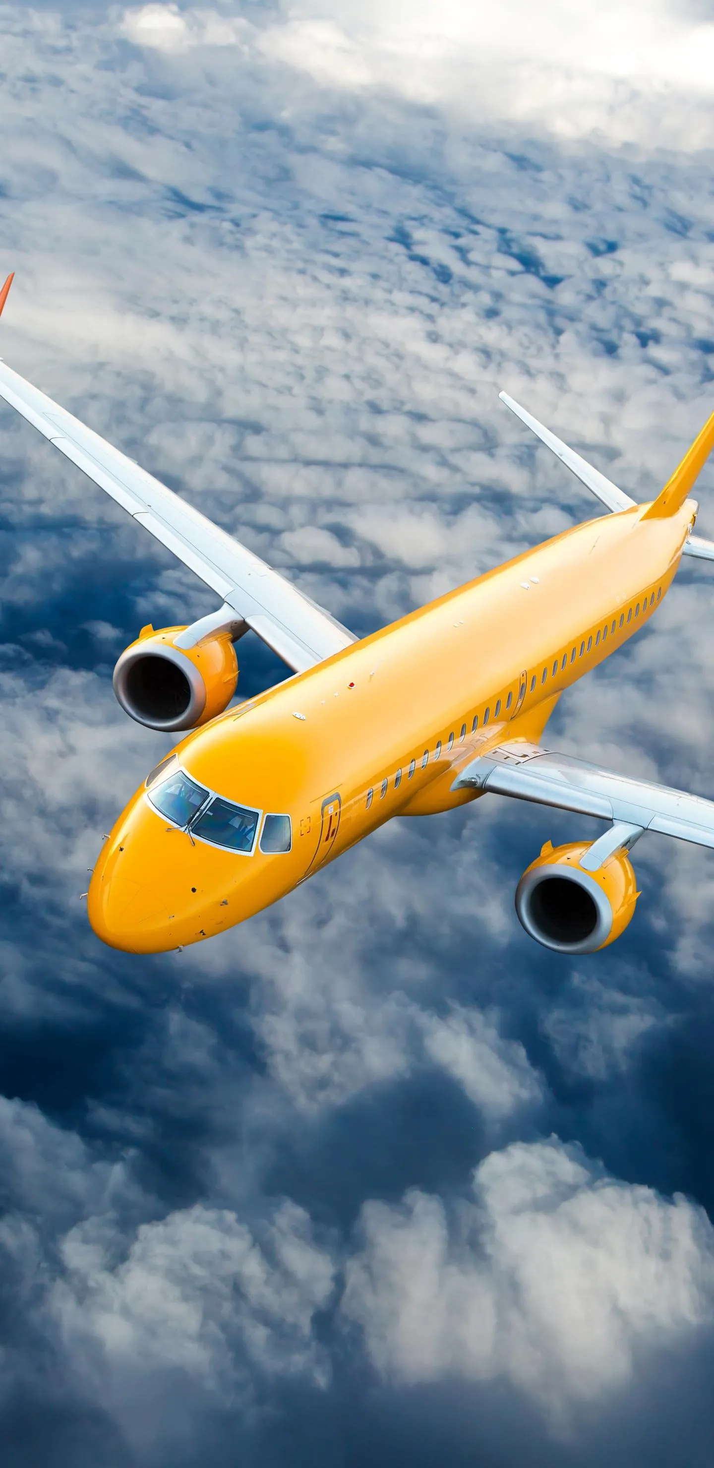 Yellow Airplane Flying Over Cloudy Sky in Daylight Wallpaper