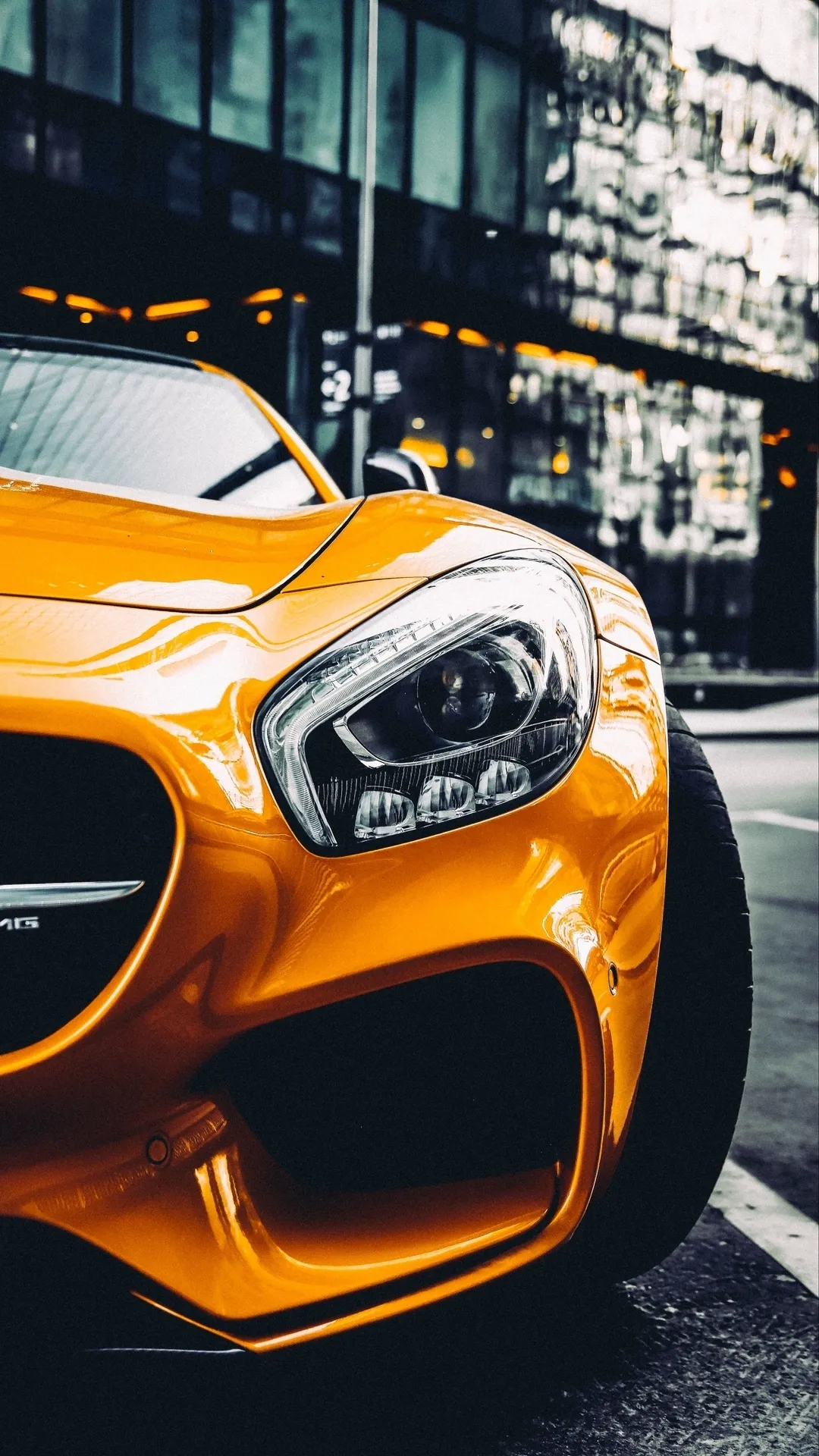 Yellow Luxury Sports Car Parked in City Street Wallpaper