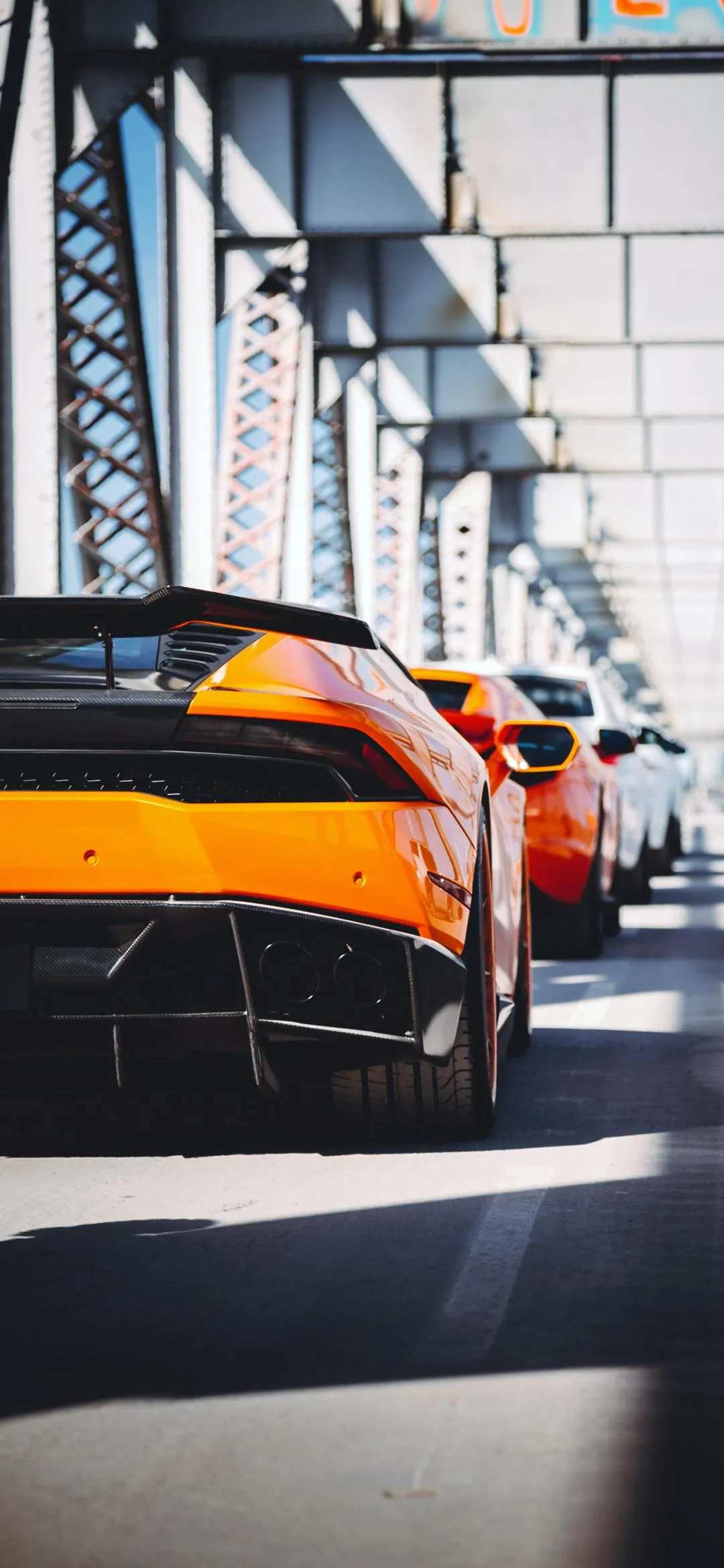 Yellow Sports Car Driving under Metal Bridge Art Wallpaper