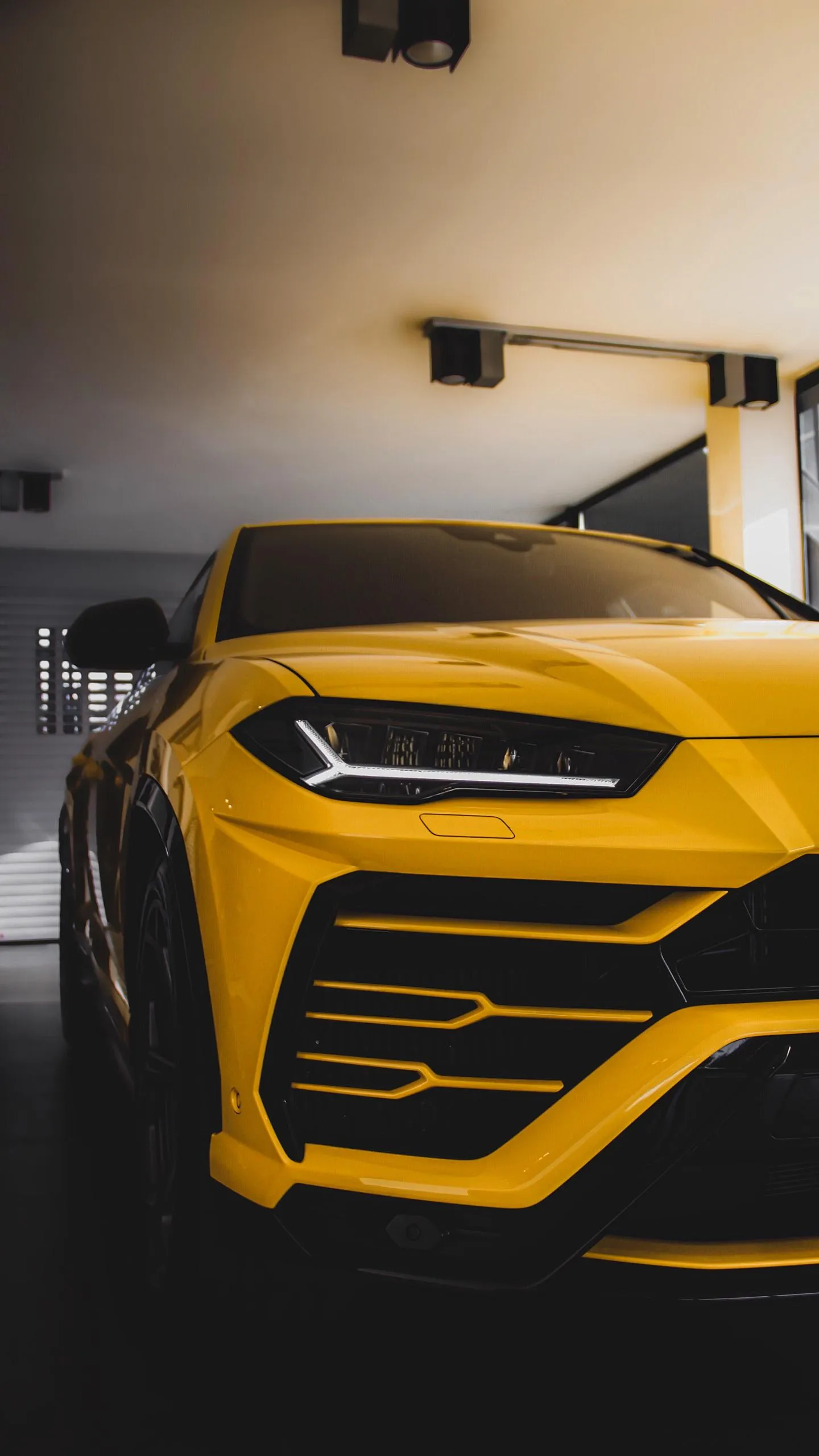 Yellow Sports Car Garage Scene 4K Mobile Wallpaper
