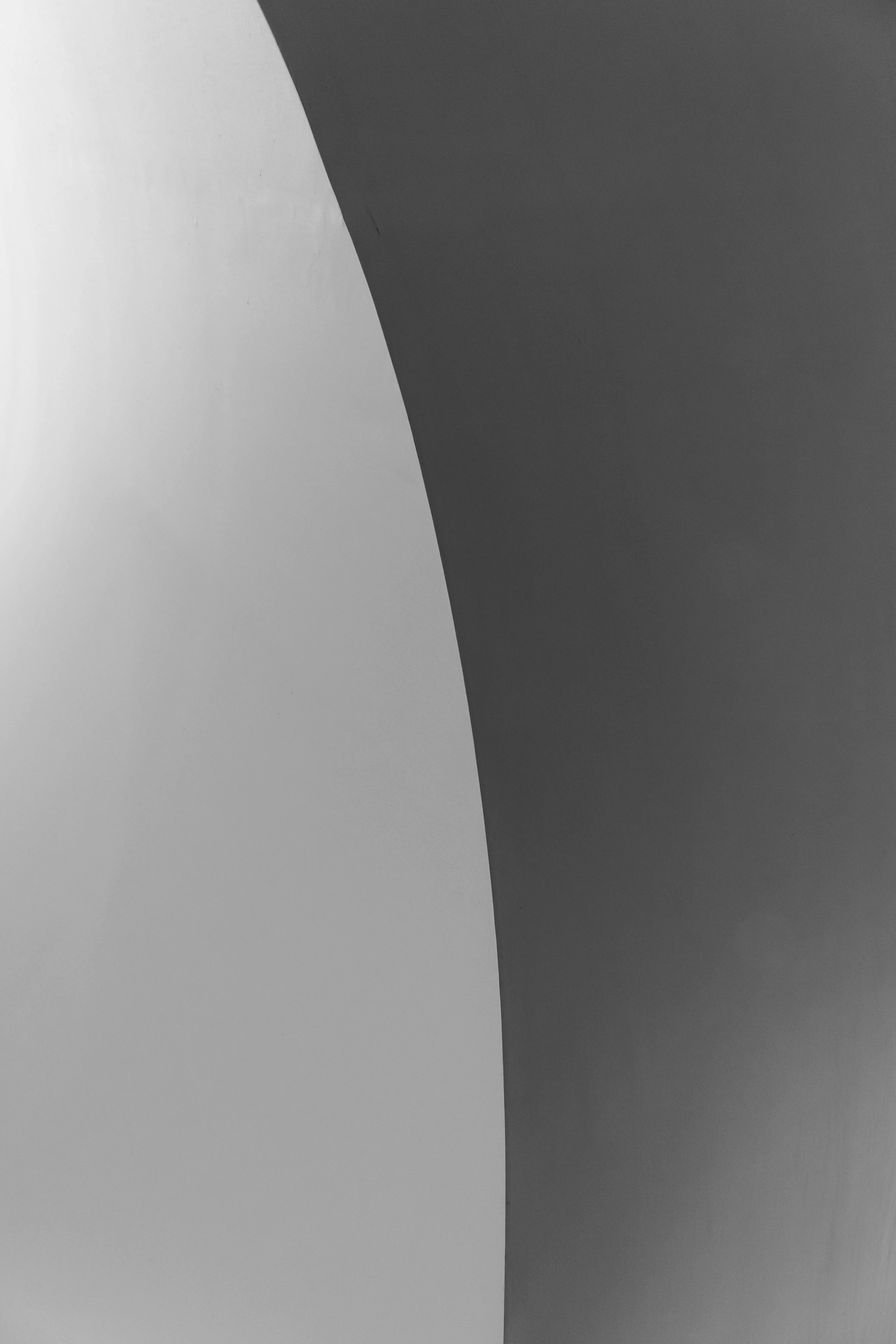 Abstract black and white image with curved shadow Wallpaper