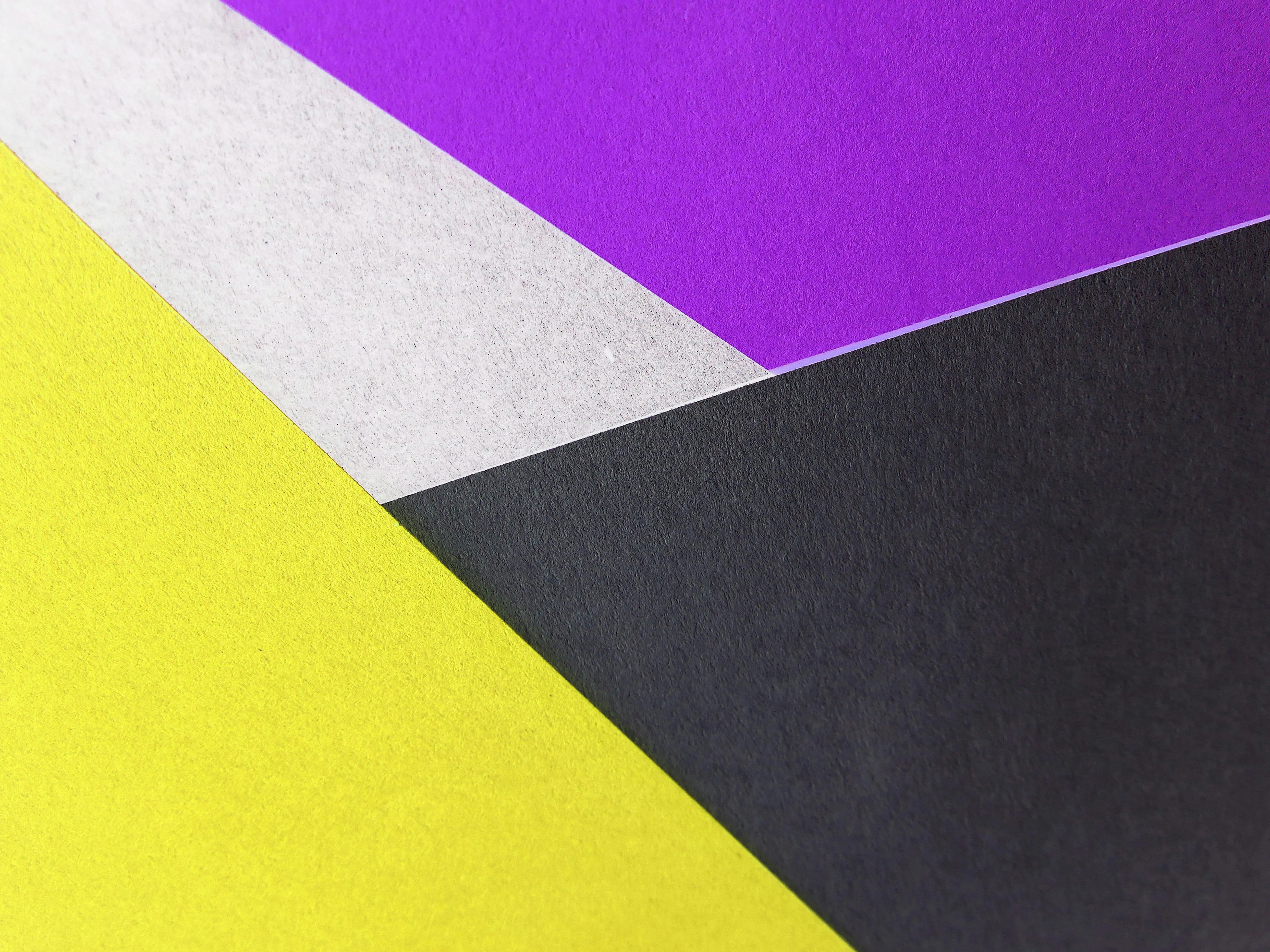Abstract geometric design with yellow black purple angles