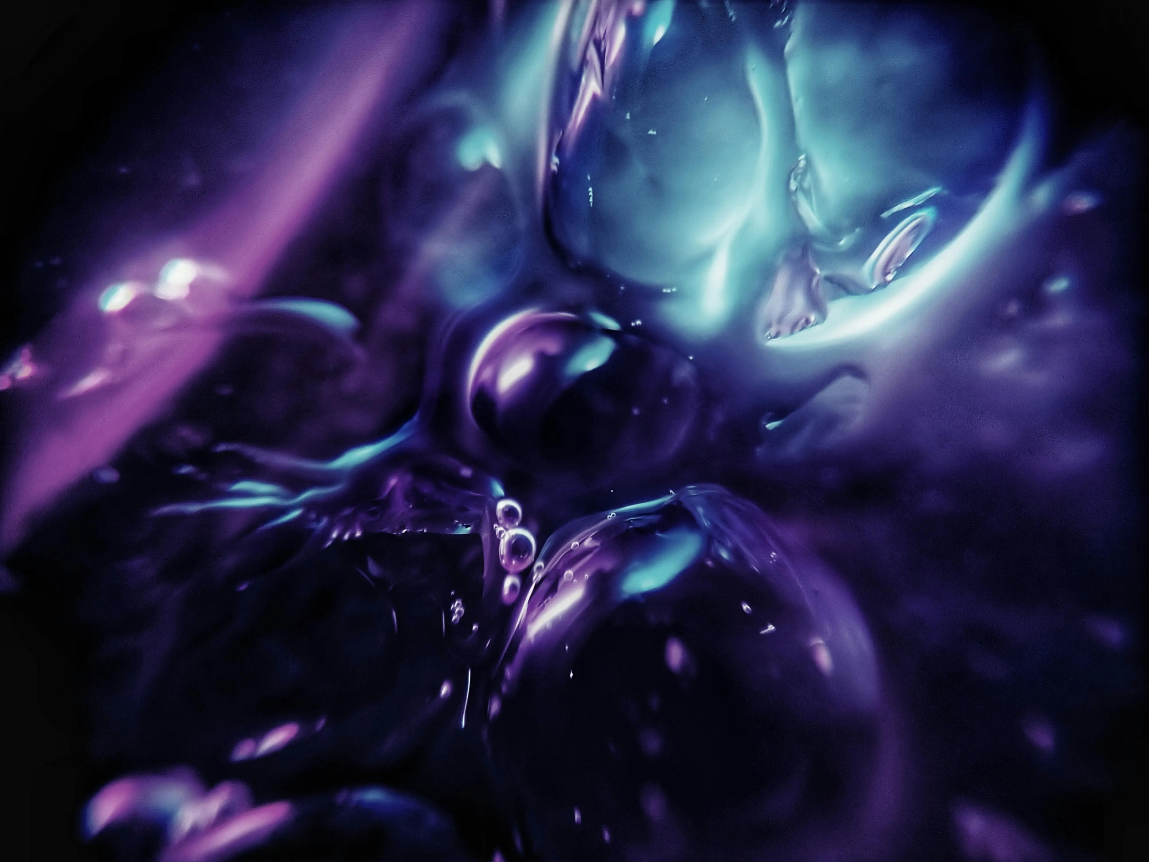 Abstract purple liquid with glossy reflective highlights